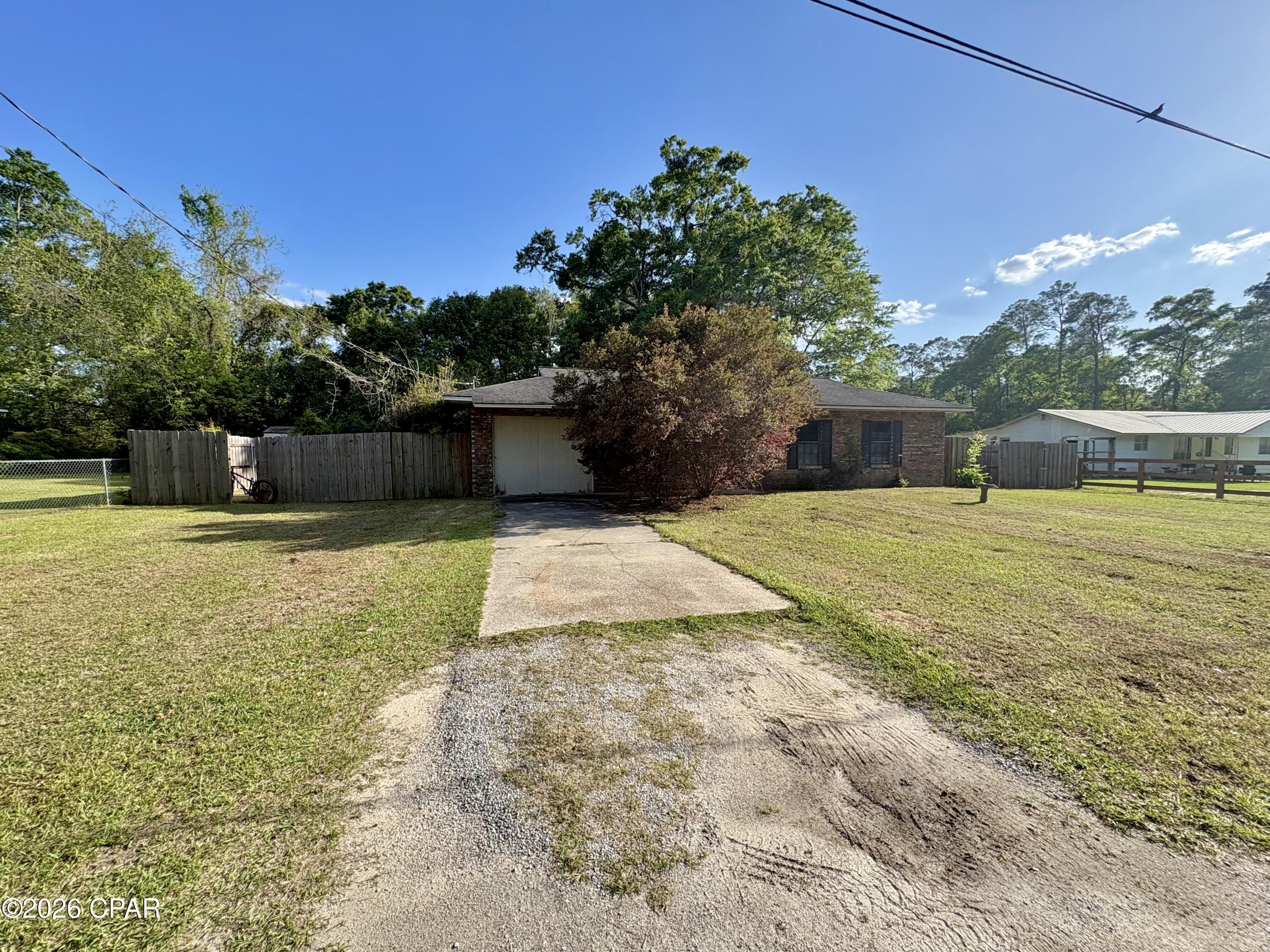 Solid brick home on a slab located in the city limits of Chipley. This 1992 home features 3 bedrooms with another room that could serve as a fourth, one bathroom, and an inside laundry room. There is a large backyard that is mostly privacy fenced and a spacious screened back porch. Updates include a shingle roof put on in 2017 and a central a/c in 2018. Brand new carpet was just installed in all of the bedrooms. There are also solar panels on the home that will be completely paid off at closing, enjoy lower power bills!  If you're looking for your own home, it will be cleaned out and ready to go upon closing. If you're looking for an income producing opportunity; with tenants already in place, this could be a great opportunity to add a rental to your portfolio that is already producing.