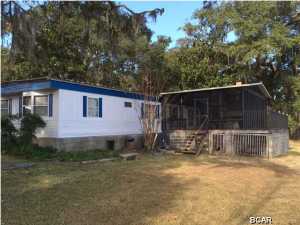 This is a three bedroom, two bath mobile home located on the Inter Coastal Waterway with amazing views. Sit on the oversized screen back patio and watch the boats come and go. This home also features a screen front proch/patio as well.