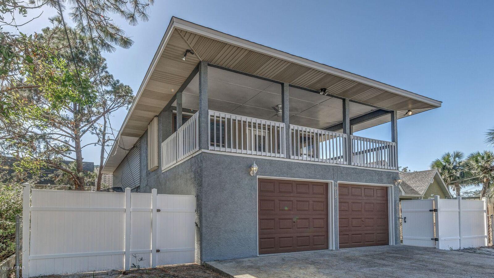 WINNER!!! You have just won the chance to live in luxury at your very own Sandcastle right across the street from the lagoon. Living on an island is something many fantasize about but few get to do it and Panama City Beach is an island. Only accessable by 3 bridges or by boat. This home has just gone through a complete remodel from the inside out. All new everything: appliances, bathrooms, flooring, paint inside and out, roof, 2 AC units, hot water heater, vinyl siding and the list goes on. This house needs ''nothing'' accept some heads in the beds. This is a 3/3 split bedroom home with very large rooms throughout. From the master bedroom through the airconditioned sun room and out on to the balcony goes a whopping 48 ft. Now thats a very large master suite to say the least. Both other bedrooms are large as well. Vinyl plank and tile flooring throughout with a master bath to die for. Custom flooring, shower and an oversized walk in closet to boot. Too much to list here so please make your appointment to see this beauty today. Move in ready.