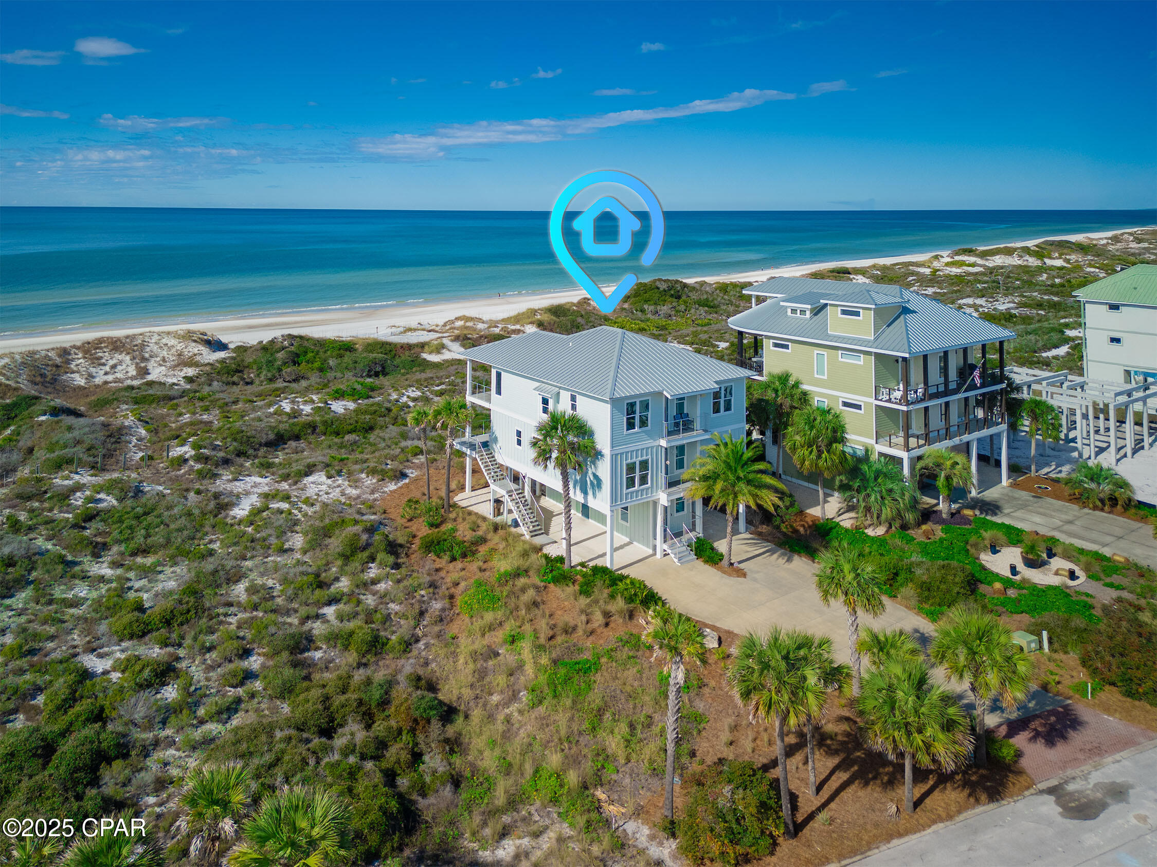 One of a kind, fully furnished, premier North Cape San Blas home with breathtaking views in every direction! Unobstructed panoramic views of turquoise blue Gulf waters, including spectacular sunsets. Long range views across the majestic green dunes of Rish Park and sunrise views over St Joe Bay. This custom crafted 3,750 sqft home faces one of the most uncrowded sections of white sand beaches on the North Cape. Meticulously maintained, never rented. The property sits at approx. 12.5' elevation in the desirable X flood zone - no flood insurance required. The top-floor living and dining area spans an impressive 38 feet wide, crowned by soaring 10-foot ceilings for an airy, open ambiance. This fully furnished 5-bedroom, 4-full-bath, 2-half-bath home has four king bedrooms, including two luxurious master suites (one handicap-friendly). The 5th bedroom has two twins and a full bed. Approx 1,000 sq ft of mostly covered Trex decks with modern stainless cable railings frame the sweeping sunsets over the Gulf. Soak up the sun or stargaze from open-air sections, and rinse off after the beach in a private outdoor shower. A ground level storage room with heat and air provides ample space for recreational gear. Conveniences abound: plenty of paved and covered parking, laundry on two levels, two refrigerators, two living spaces, and an interior elevator servicing all three levels. Built in 2018 by a premier builder, this home features certified wind mitigation construction for significant insurance savings. A private enclave of 36 lots, Hibiscus Beach & Bay community includes a pool, private beach boardwalk, gazebo, bay access with 500' bay pier, screened porch, and boat mooring. This turn-key move in ready home is a water and nature lover's paradise, with endless Gulf views and Rish Park dunes creating a serene coastal lifestyle, while buffering your investment from coastal weather! Also nearby the Cape's best amenities like St. Joseph Peninsula State park, dining and shopping!