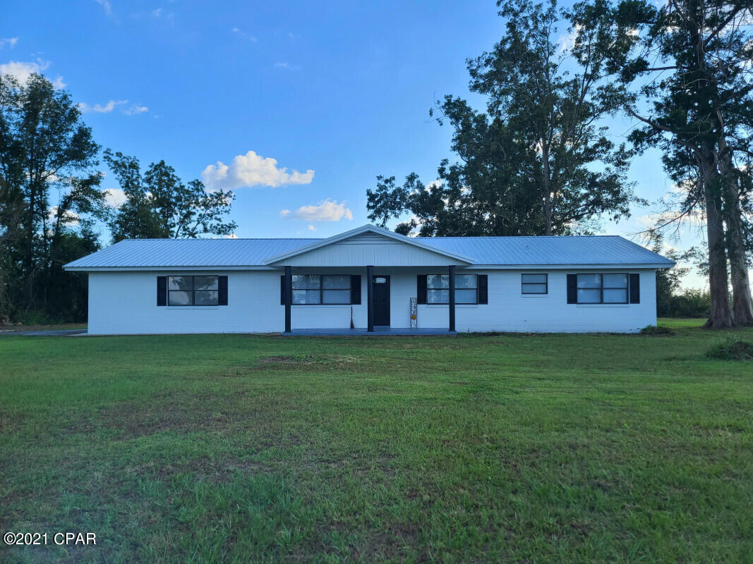 Newly Renovated! 4/2 ranch home located 7 miles south of Marianna, Florida, a few lots from Hwy 71. Positioned on a 1.25-acre lot. Fresh paint found throughout. Open floor plan with new wide plank laminate floor throughout, stylish fixtures, and neutral decor. Roomy, stylish kitchen is lovely with natural light, fresh updates, and an abundance of cabinet storage space which features a delightful custom island. Attached two-car garage can provide a nice area for family gathering events or allows the opportunity for an easy conversion to a large family/ rec room if desired. *Note* This property will be furnished with premium stainless steel kitchen appliances (refrigerator, stove, and dishwasher.