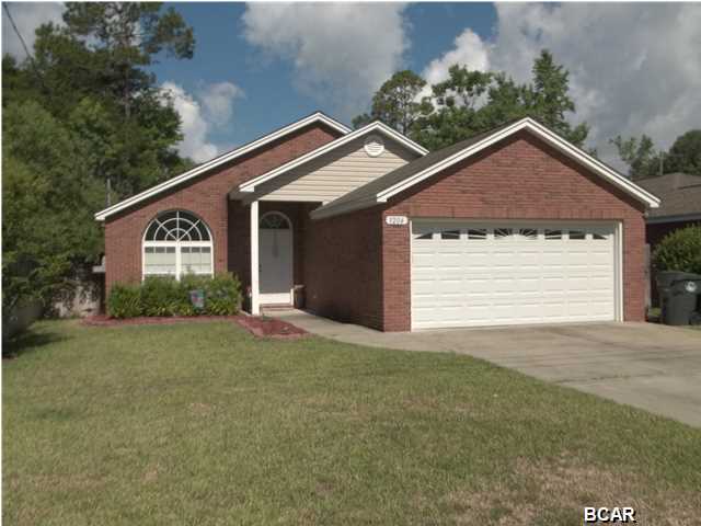 PRICE REDUCED!!! BUILDER PARADE HOME IN 2006! Come see this well designed three bedroom two bath home located centrally in desirable Lynn Haven. The interior of this home features an open floor plan with great space utilization, ideal for the family lifestyle or entertaining. The kitchen boasts stainless steel appliances, all wood cabinets with a beautiful maple stain, and solid surface countertops. The dining area has been upgraded with hardwood flooring and an ornate chandelier. The spacious master bedroom includes a tray ceiling, a plantation style ceiling fan and an adjoining master bath with a whirlpool tub and separate walk in shower.Large fenced in back yard, ideal for the kids' activities or back yard grill out parties.**SELLER MOTIVATED-BRING AN OFFER!!