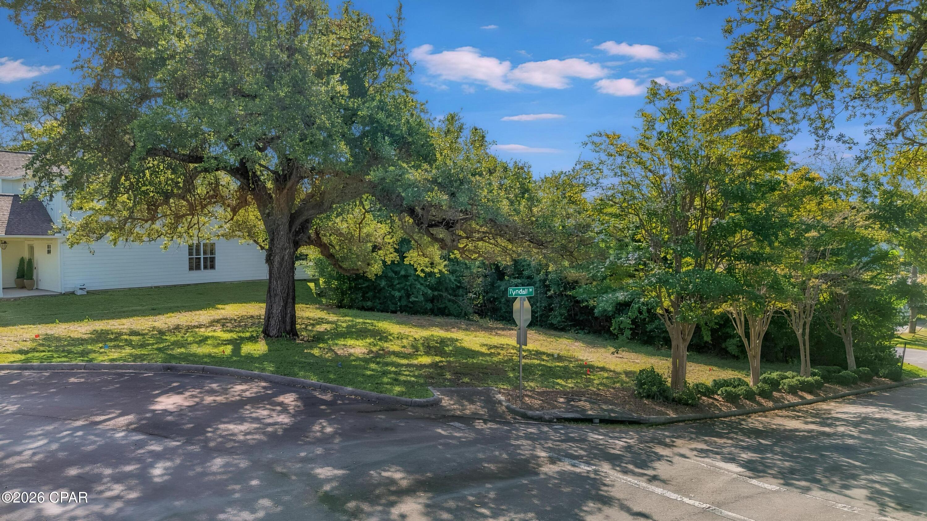 High and Dry, Flood Zone X, water, sewer, and power at the road. Survey in hand. 1150 Cove Pointe Dr is ready to build on!

This .199-acre homesite sits on a quiet interior street in Cove Pointe, a small single-family community on Watson Bayou. Owners share a private day dock -- from there you're into St. Andrews Bay and out to the Gulf with no overhead obstructions along the way.

There's real history on this ground. It was Cove Gardens, built in the early 1940s as the only military housing in Bay County. When the Air Force released it, an act of Congress routed the sale through the City so the proceeds would go back to Tyndall, and the City wrote the development rules itself, low density, protect the trees. That's why the oaks are still standing. The developer removed all 133 units, restored the site, and put in new roads, utilities, drainage, and the community dock. Fifty-eight lots in all, completed in 2006.

HOA dues are $700 a year. Minimum build is 1,800 heated and cooled square feet, with a two-car garage and architectural review. In-ground pools are permitted. Short-term rentals are not, so this is a neighborhood people live in. A community park, named for one of the original partners, is planned and not yet built.

Downtown Panama City's waterfront district is minutes by car or golf cart. Restaurants, Marinas, St. Andrews Bay Yacht Club, and Bay Medical are all close.

Survey, covenants, and design guidelines available on request. Schedule your showing today!