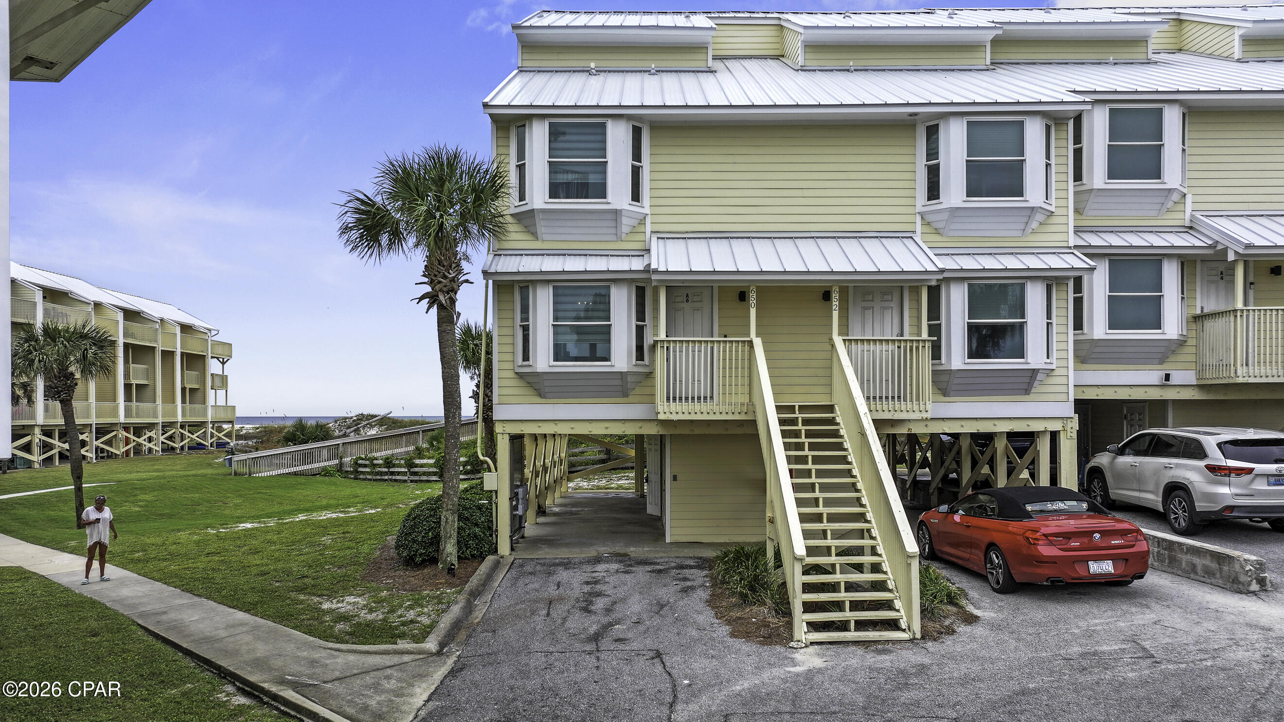 CURRENTLY UNDER CONTRACT, SELLER WILL CONSIDER BACKUP OFFERS.  SUNSETS & SEASHELLS AWAIT!! Experience the best of Gulf-front living in this beautifully updated 3BR/3BA end-unit townhome nestled within the gated Sea Cliffs community on the highly desirable North Cape San Blas. Offering additional privacy, extra natural light, and breathtaking panoramic Gulf views, this coastal retreat places you just steps from the sugar-white sand and emerald waters of Florida's Forgotten Coast. The open-concept living area is designed for effortless entertaining with luxury vinyl plank flooring, a stylish kitchen featuring granite countertops, stainless steel appliances, a breakfast bar, and seamless access to a spacious Gulf-front balcony where spectacular sunsets become part of your everyday routine. Upstairs, two comfortable guest bedrooms share a convenient Jack & Jill bath, including a waterfront bedroom with its own private sundeck and a second bedroom offering a peek of St. Joseph Bay. The top-floor primary suite is a peaceful escape featuring a walk-in closet, double vanity, beautifully tiled walk-in shower, and a private balcony perfect for enjoying sunrise skies and refreshing coastal breezes. Offered fully furnished and completely rental-ready, this proven income-producing property includes quality furnishings, cookware, a Keurig, air fryer, and everything needed to welcome guests from day one. The ground level provides covered parking, generous storage, and an outdoor shower for rinsing off after long days on the beach. Sea Cliffs continues to impress with a recently upgraded beach boardwalk complete with a convenient ramp for beach carts, a resurfaced community pool, and a new playground, creating an ideal setting for families, vacationers, and owners alike. Whether you're searching for a primary residence, vacation getaway, or exceptional investment property, this rare Gulf-front end unit delivers the coastal lifestyle you've been dreaming of. Call for your private tour & LIVE THE BEACH LIFE!