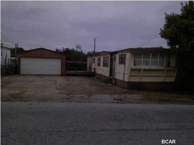 Own a piece of paradise for under 50k. Walk to the beach! This ''fixer upper'' could be restored or could be tore down in order to build your dream home All measurements are approximate. Buyer to verify if important. NOTE: 2500 escrow deposit required and 5 day inspection. Owner financing available.