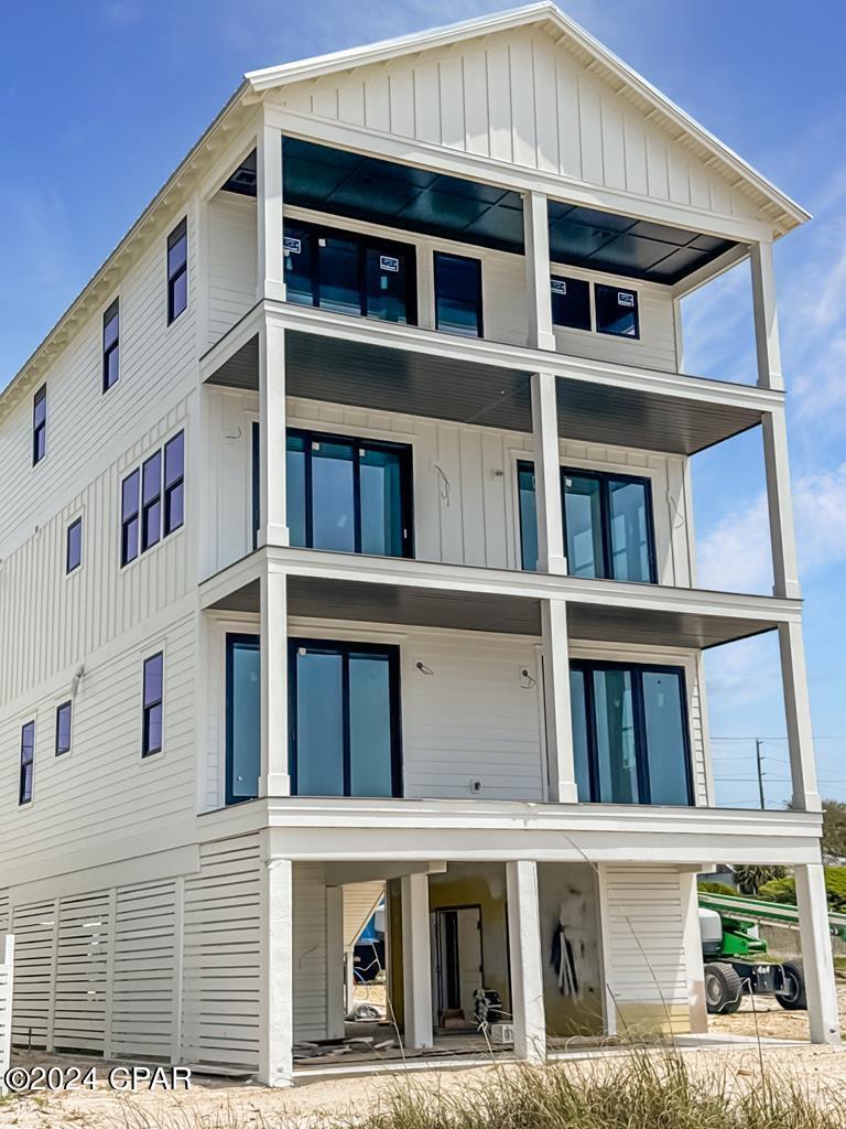 STUNNING GULF FRONT BEACH HOUSE CUSTOM BUILT WITH 6BR/6.5BA READY TO PREVIEW IN ST JOE BEACH! If you're ready to live the beach life, 9113 W Hwy 98 delivers on all fronts with luxury finishes throughout and added elements for comfort and tranquility. Beginning on the ground floor you'll find a grand outdoor entertainment space comprised of a gulf front pool & fire pit, outdoor bar & kitchen and a commercial Ice maker. A Ping pong table sets the stage for competition and an outdoor TV for game day. As an added bonus an enclosed outdoor shower & bathroom are provided along with boardwalk beach access to sugar white sand making your beach set up a breeze. Take the elevator to the first floor with incomparable water view and open concept main level living space. An immaculately designed kitchen will include solid surface counters, high end appliances and custom cabinetry. Extend your dining space outdoors & wow your guests with breathtaking sunsets over the gulf. Included on the first floor is a primary suite with plans for dual vanities and a walk-in closet. The second-floor design fully utilizes guest space with two gulf facing suites each with private balcony access and a separate living area for lounging & gaming. The bunk suite provides a pair of built-in queen bunkbeds and a nicely appointed bath maximizing sleeping arrangement. The elevator extends to the third level and opens to yet another guest suite. Also featured in the layout is lux primary suite offering optimal privacy and a spa like experience. From the freestanding tub and the walk-in shower to the built-in coffee bar, this will arguably be the most sought-after room in the home. Thoughtfully designed and meticulously planned, it is evident the amount of detail and care poured into every element of this modern showstopper. Calling all investors! The expected completion is June 2024. Be the first to preview! Call for a list of features & schedule a private viewing today!