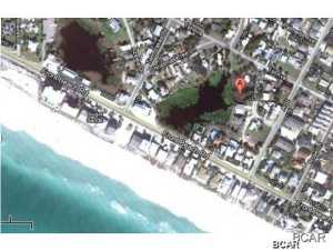 Opportunity is knocking to build your dream home on a lake within a couple blocks to the beach. This oversize lot is on the desirable west end of the beach. This lot is zoned Multi Family and would make a great rental with a short stroll to beach access 85. It has 65 feet street side and 65ft of lake frontage. You might even get a view to the gulf if you build a second story. Owner is a Licensed Realtor.