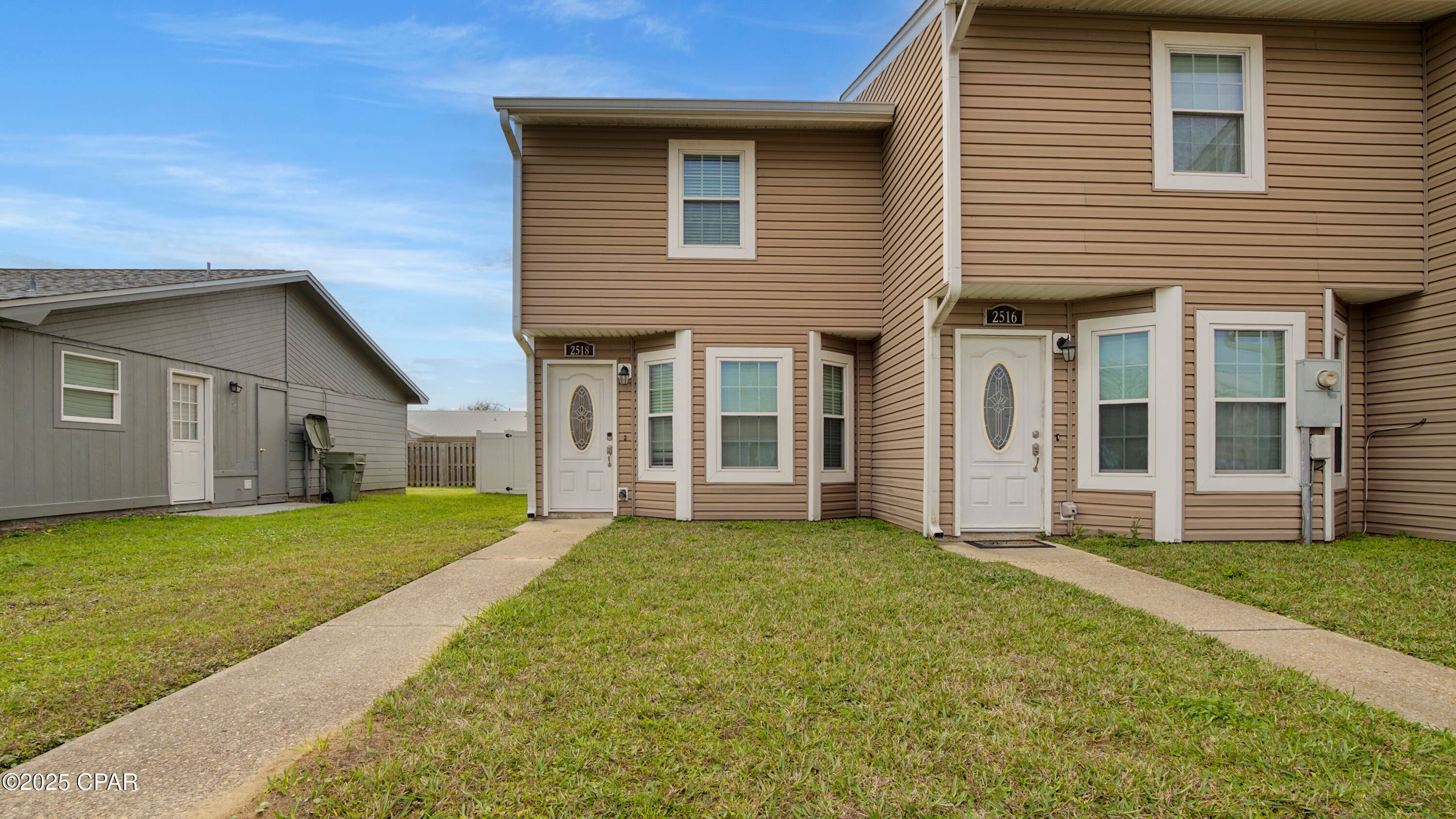 2 bedroom, 1.5 bath townhome in Lynn Haven! Walking distance to Publix, Starbucks, Waffle House and much more! There are 2 bedrooms (carpeted) and a full bathroom (ceramic tile) upstairs. Main level features all ceramic tile with a living room, dining area, 1/2 bath, and laundry. The kitchen features custom cabinets, granite counter tops, and stainless steel appliances. There is a screened patio overlooking the fenced backyard. 2 parking spaces in front of the unit.  LAWN maintenance included in the rent.