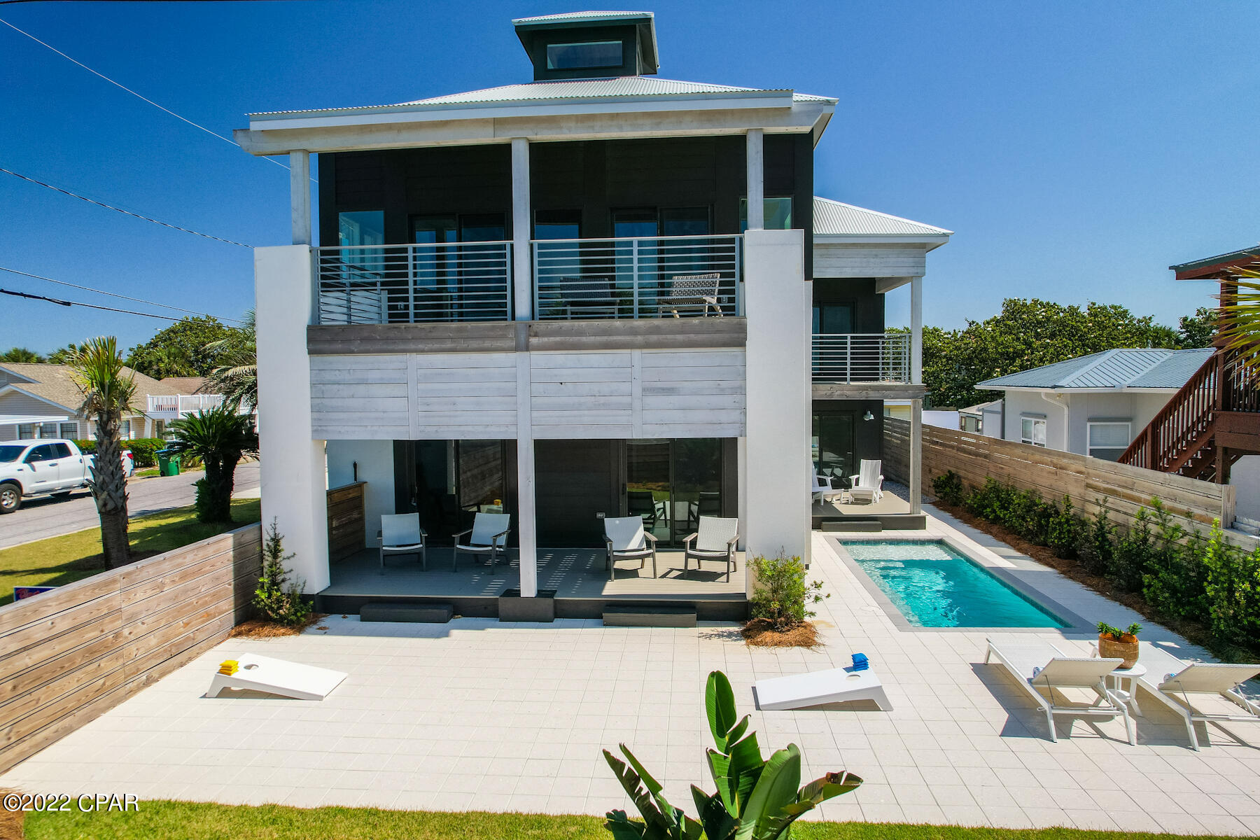 Bid A Wee Beach House for sale! Built in 2020 and located directly across street from dedicated beach gives the property unobstructed beach views forever. The view from the second floor where you'll have your main living, kitchen, and dining area are incredible. Fenced-in yard with private pool.  The main living floor features a reclaimed wood covered, cathedral style ceiling with skylights that give the home a sun-lit, spacious and beachy feel.  Home is being sold fully furnished and decorated by the design team at Holiday Beach Décor and will be ready for the upcoming summer season. Bedrooms are still being furnished and decorated, more pictures coming soon!