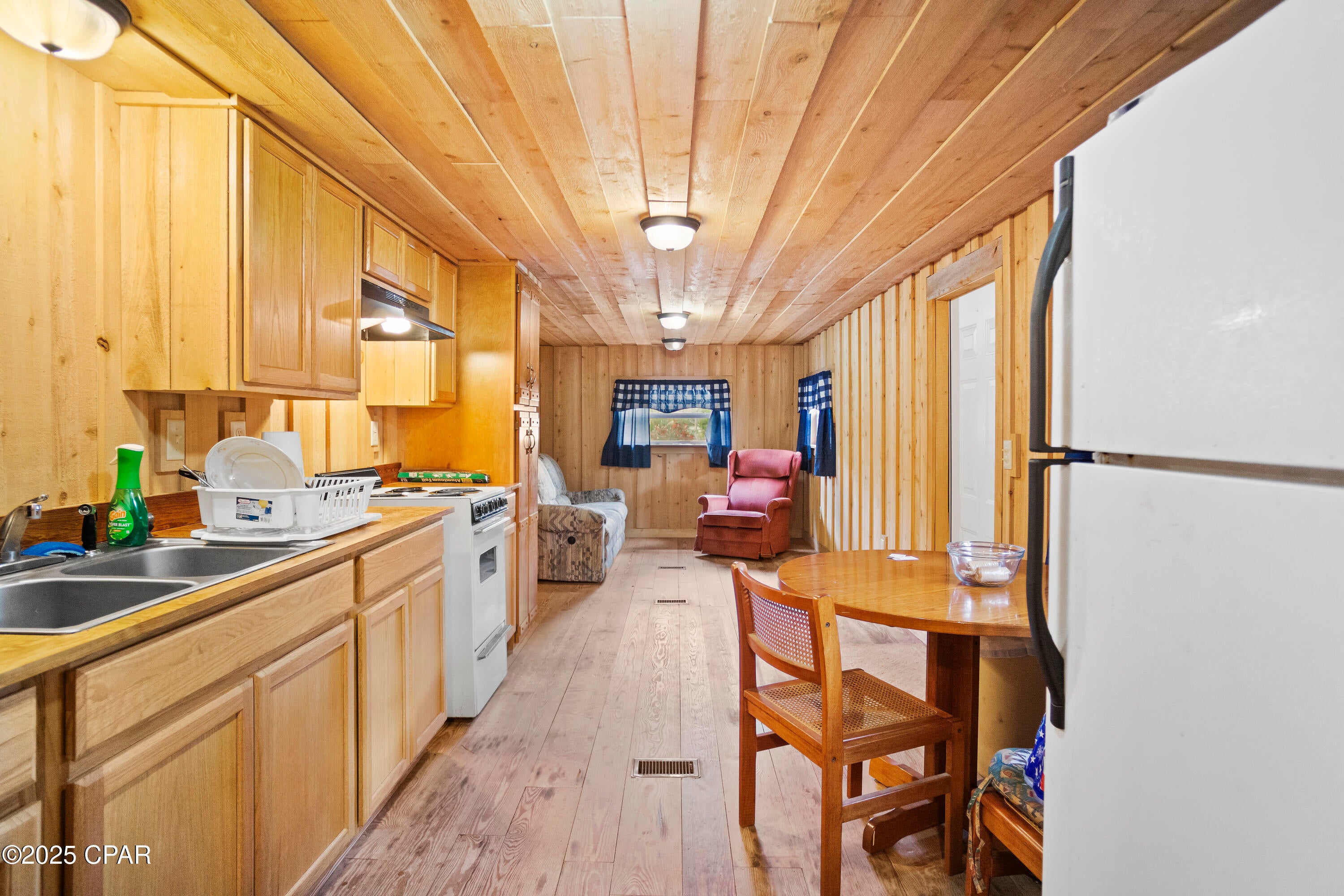 Fishing + hunting camphouse • 0.55 mi to Chipola River • $800/month rental income • 0.307 acres • Covered porch • Kinard, FL

Set in the Florida Panhandle, this Kinard camphouse offers a practical base for outdoor recreation with income already in place. Located at 14443 SW T D Barker Rd, Kinard, FL 32449, the property includes 2 bedrooms, 2 baths, and 1,079 sq ft on approximately 0.307 acres. The Chipola River is about 0.55 mi away for freshwater fishing, and Mexico Beach is approximately 45 minutes away for saltwater access, boating, and beach days. Inside, the layout supports simple everyday use or weekend stays, with central heat and air, an electric range, refrigerator, well, and septic. Outdoor features include a covered porch, cleared corner lot, paved county road frontage, and a dead-end road setting. The property is tenant-occupied and currently leased at $800 per month, with the rental potentially continuing for the new owner. A strong option for those seeking a recreational camphouse, rental income, or a Florida Panhandle getaway with river access nearby.