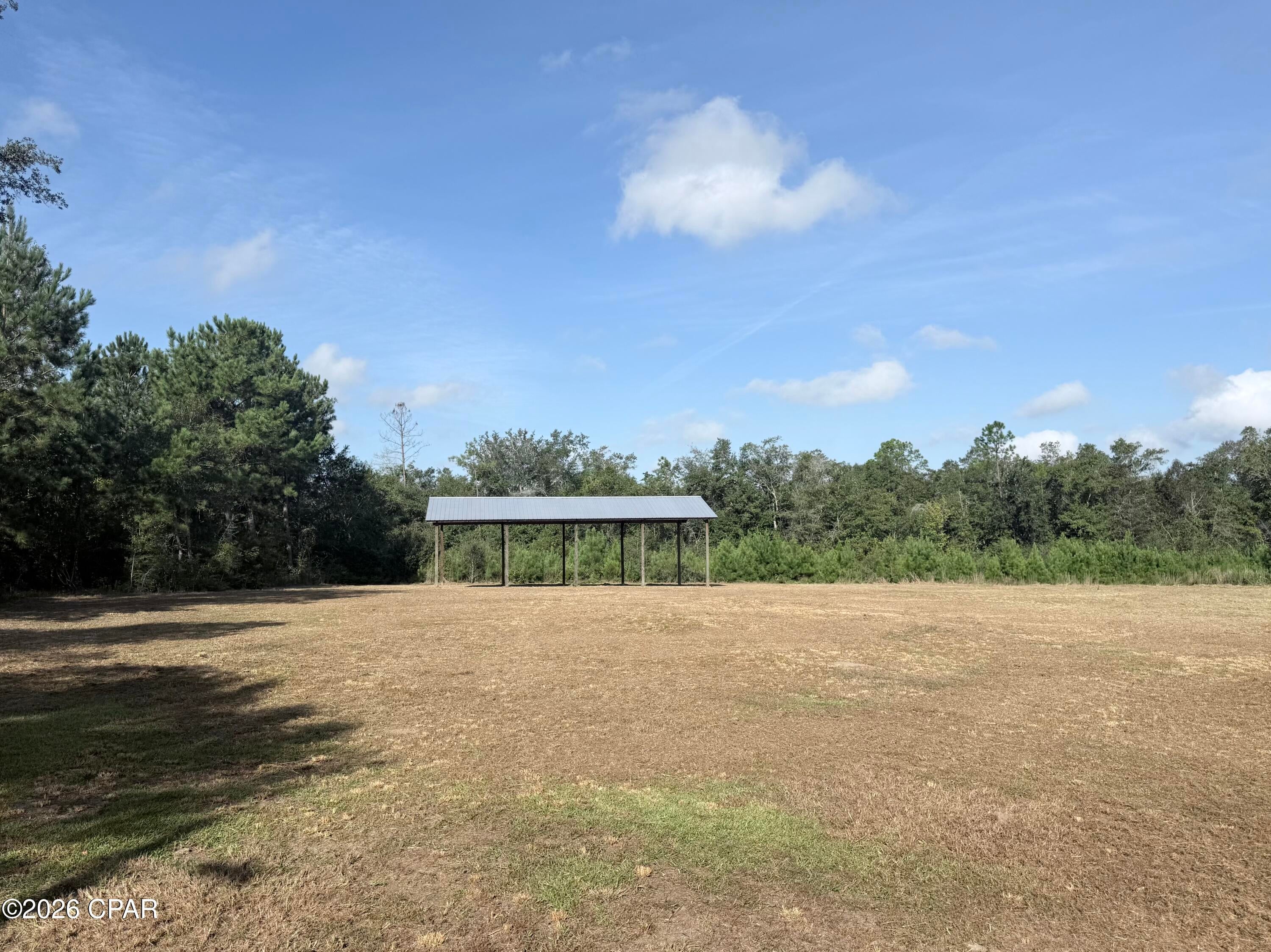 Discover the possibilities with this beautiful 20-acre property, conveniently located just one mile off Highway 231 and less than 45 minutes from Panama City, Florida. Whether you're looking for a private homesite, weekend getaway, or hunting retreat, this property offers plenty of room to make it your own.

Already equipped with a pole barn, telephone box, electricity, and a well, much of the groundwork is in place for your future plans. A pond on the property provides excellent opportunities for duck hunting and adds to the property's recreational appeal.

With 20 acres to enjoy, there's plenty of space for a homesite, animals, gardens, outdoor recreation, and more. Create your own country homestead, hunting camp, or peaceful escape while still being within an easy drive of Panama City and area amenities. Bring your plans and enjoy the privacy and possibilities this versatile property has to offer!