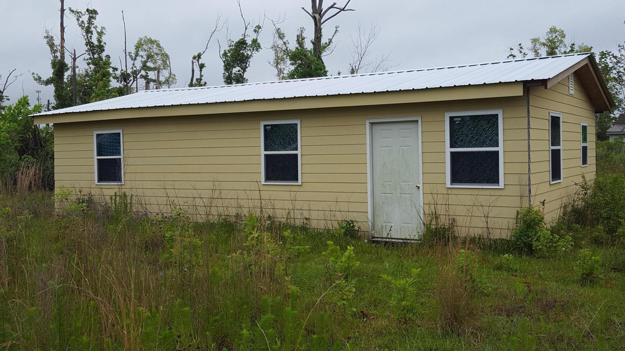 'CURRENTLY UNDER CONTRACT, SELLER ACCEPTING BACKUP OFFERS'PRICE REDUCTION! MOTIVATED SELLER!! HANDYMAN'S SPECIAL OR AN INVESTOR'S DELIGHT TO (RENT OR FLIP). This home is being sold ''As Is'' and has been partially restored since Hurricane Michael. The roof has been replaced with a new metal roof. The exterior siding and windows are also brand new. The walls inside the house are partially complete, but need to be finished, mudded, sanded and painted. There are also additional interior modifications needed. The flooring has linoleum that has not been completely glued down.  The location is close to restaurants, shopping and schools. All measurements are subject to verification.
