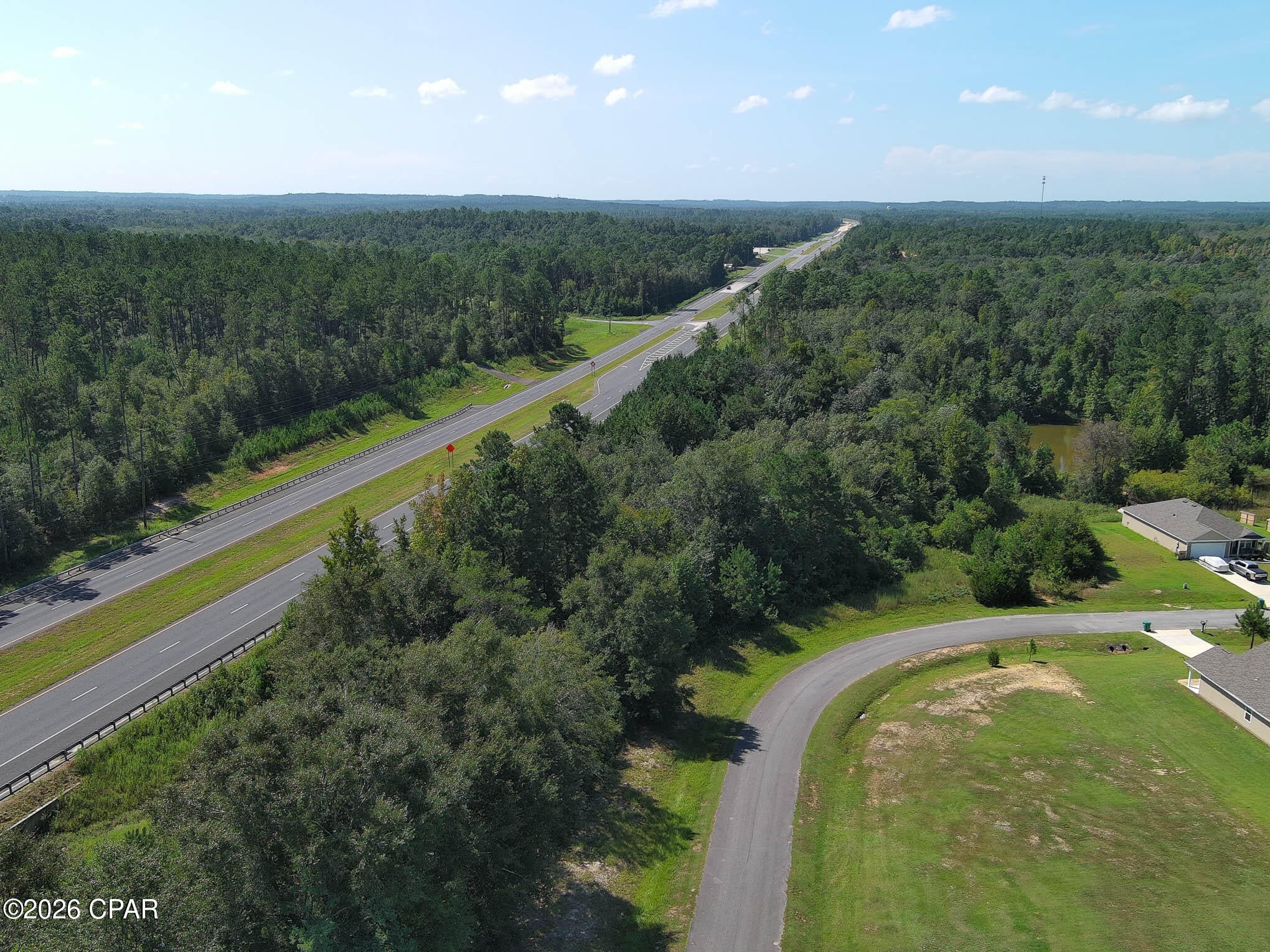 Discover a prime development opportunity with this expansive 5.69-acre parcel strategically positioned along the highly visible Highway 77 corridor in Chipley, FL. Boasting excellent frontage on one of the area's busiest thoroughfares, this property offers unparalleled exposure for commercial, retail, or mixed-use development. Additionally, a contiguous 2-acre retention pond parcel is available for purchase, providing essential stormwater management infrastructure and enhancing the site's readiness for immediate construction. This is a rare chance to secure a significant landholding in a high-traffic location with the necessary utilities and drainage solutions already in place. Don't miss this exceptional investment in Washington County.
All measurements are approximate and must be verified by buyer