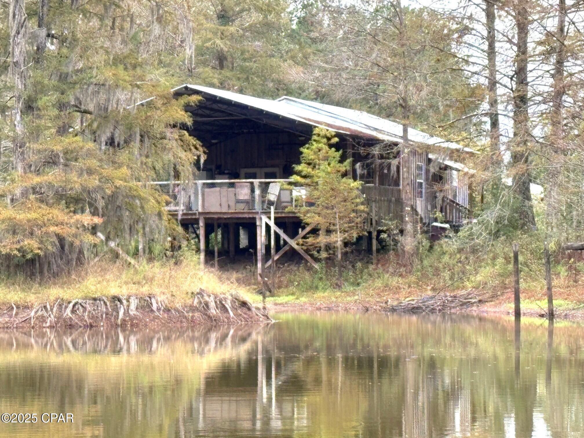 531.92+/- ACRE recreational tract/timber farm with a nice fish pond and Cabin sitting on the pond. The Cabin was built from timber and rough cut boards that came off this property when cut years agao. Great deer hunting along with turkey, duck and more. A great road system through out the property. The property fronts North Golden Road, Overpass Rd and Railroad Ave. There is about 3/4 mile of railroad frontage for possible future use. There are approximately 220 Acres in Loblolly Elite Trees that were planted in 2023, another 40+/- Acres of Long leaf Pines that were planted in 2017 and another 230 +/- acres of loblolly elite pines planted in 2019. Numerous pear and japanese persimmon trees planted around for the game. There is a 8 inch well that has been converted to a 4'' well for the cabin. The only way to describe this property is to invite you to come ride around and check it all out.