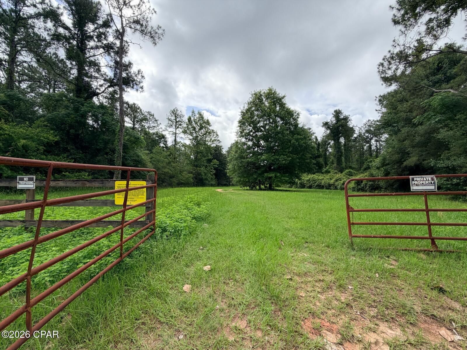 Beautiful 7.14-acre homesite located in the desirable Reedy Creek Crossing subdivision in Holmes County, Florida! This wooded parcel offers the perfect opportunity to build your dream home or weekend getaway surrounded by nature and abundant wildlife.

Many of the surrounding lots remain undeveloped, creating a peaceful and private setting with plenty of natural beauty. Reedy Creek Crossing features underground electricity available at the corner of each lot, reasonable building restrictions with no mobile or modular homes permitted, and an HOA that helps maintain the private roads throughout the community.

A survey is available for the property. Conveniently located less than 30 minutes from Walton County and approximately an hour from Panama City Beach, this property offers the perfect balance of quiet country living while still being within reach of the beaches, shopping, and dining.

Whether you're looking for a full-time residence, vacation retreat, or long-term investment, this beautiful acreage is worth a look. Drive by today and experience the beauty and privacy Reedy Creek Crossing has to offer!