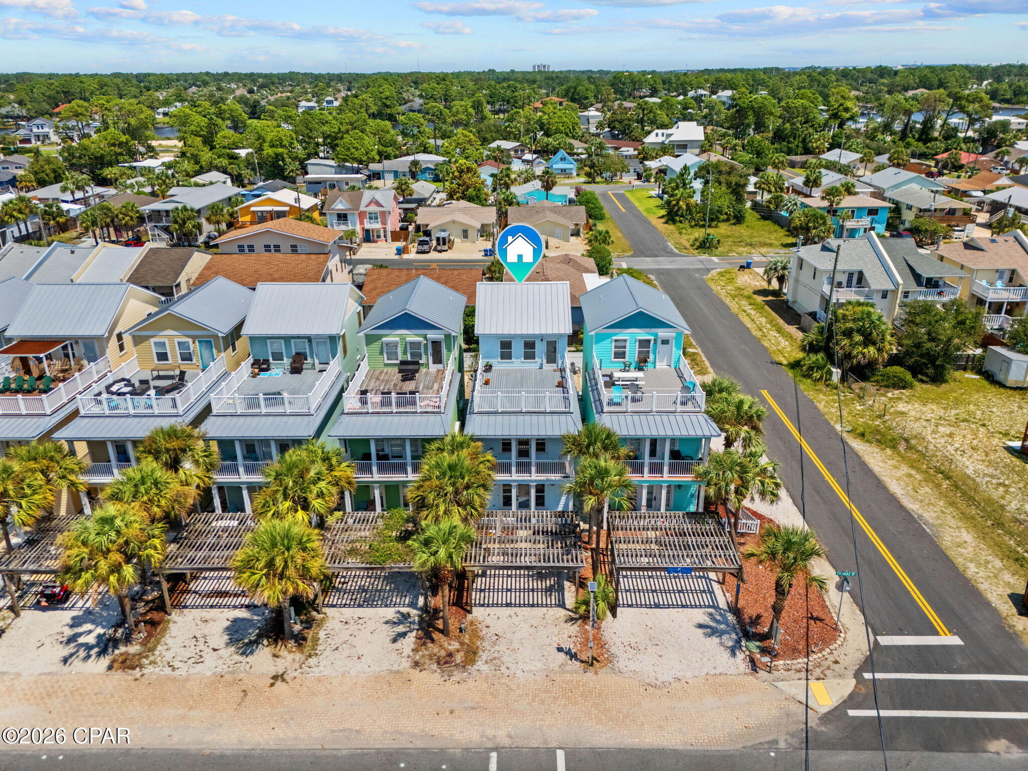 Gulf View! Three-Story Beach Home with Private Pool.

This home is situated directly across from Rick Seltzer Park, which provides easy public beach access and helps preserve the home's Gulf views. This 3 bedroom, 3.5 bath home offers an open, flexible floor plan that works well as a primary residence, second home, or income-producing vacation rental and could comfortably accommodate 8 to 12 guests.

The main living area offers an open-concept living, dining, and kitchen space featuring a natural gas fireplace, 11-foot ceilings, crown molding, recessed lighting, and tile flooring. The kitchen features stainless steel appliances, granite countertops, a large island breakfast bar, solid wood cabinetry with roll-out shelves, and a pantry.

Toward the rear of the main level, you'll find a bedroom with a large walk-in closet. The laundry room provides additional storage and is equipped with a stackable washer and dryer. A full bathroom on this level features granite countertop and a tub/shower combination.

The second floor offers the primary suite with a spacious private balcony, walk-in closet, built-in desk, and an ensuite bath featuring granite countertops, a jetted soaking tub, and a glass-enclosed tile walk-in shower.

In addition, there is a secondary suite on this level, which also includes a built-in desk and shelving, a walk-in closet, and a private bathroom with granite countertop and a tub/shower combination.

The third floor provides an additional living and entertainment area with vaulted ceilings, a wet bar, and a half bath. This versatile space is ideal for entertaining, relaxing, or providing additional sleeping accommodations.

Step outside onto the spacious 18' x 24' sun deck and enjoy wonderful views overlooking the park, beach, and Gulf.

The backyard is fully enclosed with vinyl fencing and features a heated in-ground pool.

Recent updates include the pool being resurfaced in 2021, composite decking replaced in 2023, and two HVAC systems replaced in December 2021 and September 2023. The tankless water heater was replaced in June 2020. ** NO HOA**

Enjoy the convenience of being within walking distance of public beach access while staying close to shopping, dining, entertainment, and some of the Emerald Coast's most popular destinations. Outdoor enthusiasts will love the endless recreational opportunities nearby, including biking, golfing, boating, fishing, and unforgettable sunset strolls along the beach.

Take in the natural beauty and relaxed coastal atmosphere that make this area so desirable. Whether you're searching for a primary residence, a vacation getaway, or an income-producing investment property, this coastal gem offers an exceptional opportunity to enjoy the Florida beach lifestyle.  Schedule your private showing today and start living the beach lifestyle you've been dreaming of!