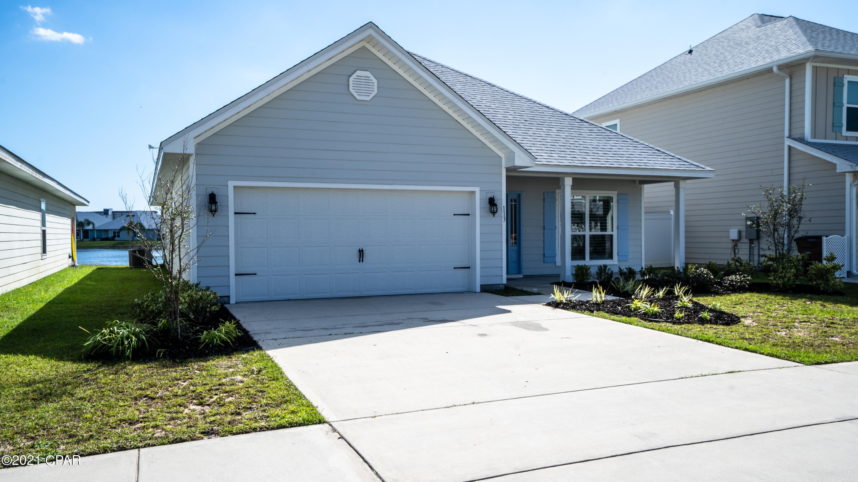 What an opportunity!  Beautiful one level home within walking distance to pier and beach.  Enjoy the community lake from your screened-in porch.  This home is like-new, light and bright, move in ready!  Lots to Love Here!