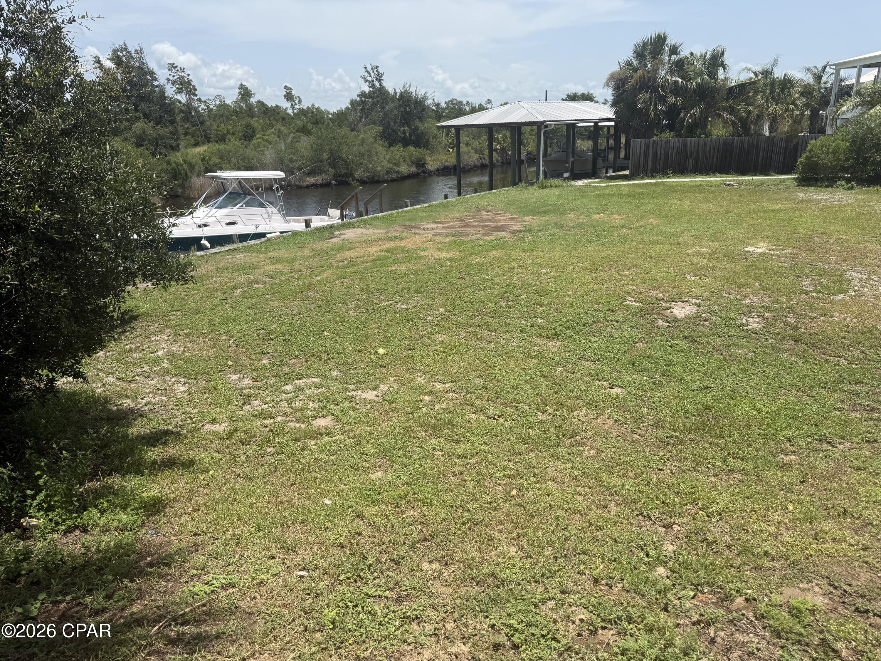 Build your dream coastal retreat on this desirable canal-front lot in beautiful Mexico Beach, Florida. Offering direct water access to the Gulf of America, this property presents an exceptional opportunity for boating, fishing, kayaking, and enjoying the laid-back waterfront lifestyle that makes this community so special. With approximately over 100' of seawall and dock in place, one can save tens of thousands of dollars for improvements. Imagine stepping from your future home to your boat and heading out for a day on the open water. Conveniently located near the sugar-white beaches, local restaurants, shopping, parks, and other community amenities, this homesite is well suited for a primary residence, vacation getaway, or investment property. The canal frontage adds tremendous appeal for buyers seeking easy access to world-class fishing and boating while remaining close to everything Mexico Beach has to offer. Enjoy peaceful mornings by the water, unforgettable sunsets, and the relaxed atmosphere of one of Florida's most charming coastal communities. With nearby access to Port St. Joe and Panama City, you can enjoy a quiet beach-town setting without sacrificing convenience. Whether you envision a custom waterfront residence, second home, or vacation rental, this property provides an outstanding canvas for your coastal vision. Canal-front opportunities with access to the Gulf of America are increasingly limited, making this a chance you will not want to miss. Per the owner; Seawall was reinforced about 2 to 3 years ago. Sewer and water tap convey with the sale. The city of Mexico Beach has verified that two homesite are possible since the parcel contains two platted lots. Some dimensions were obtained by the Bay County Property Appraiser's website, Please verify if important.