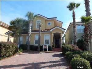 Meticulously maintained townhome that includes desirable feature of first floor bedroom and bath. Maple cabinets, black appliances, tile in all areas except bedrooms. Large porches on the side with access from bedrooms; large paver deck off of kitchen, furnished beautifully, and all furnishings convey except for a short list of personal items. Community amenities include a pool on the beach, one behind the clubhouse, tennis court, and hot tub. Community is gated and includes just one street that is near restaurants, Pier Park, airport, and retail shops. All information and measurements are approximate and should be verified by Buyer.