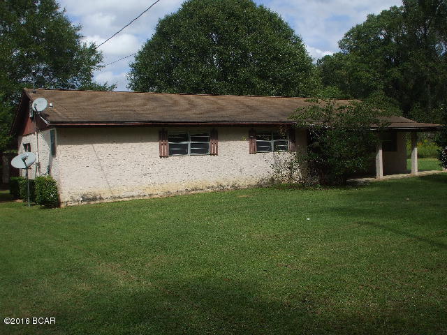 Older single family residence located on 4.5 acres of land jut south of town. Needs updates and renovations and some completions. Has potential to be a 4 bedroom 2 bath home; one bath needs to be completely installed and finishing. There is a yard building with 2 lean-tos for vehicle or lawn equipment storage. The land wold be great for crop/garden faming, horses, animals, etc. The aeial view shows evidence of a pond which may or may not be there now. The well pump and A/C unit are missing.