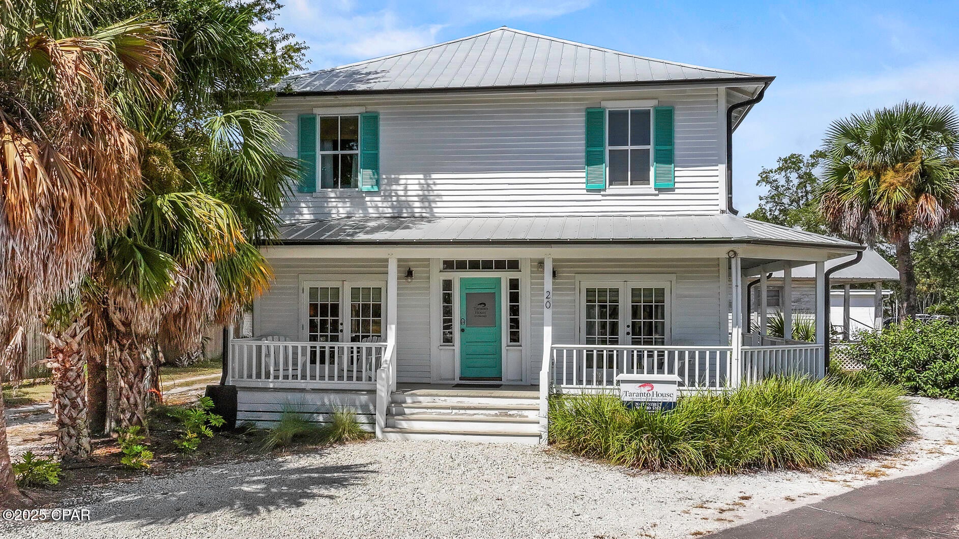 HISTORIC RENTAL GEM!! The distinguished Taranto House is named for the Taranto family & dates back to circa 1880. A beautifully restored historic treasure in the heart of enchanting Apalachicola, this 5-bedroom/5-bath residence seamlessly blends turn-of-the-century character with modern comfort, offering a rare opportunity to own a piece of local history. Perfectly positioned in the walkable downtown district, the home features five individually designed rooms, each with its own charm & each rented individually for maximum rental potential. Thoughtfully preserved to honor its historic integrity, the home has been updated with contemporary conveniences that enhance its appeal. Inviting shared spaces—including a comfortable common area & kitchen—reflect its hospitality roots while providing residential ease. From the lofty porches, enjoy glimpses of Apalachicola Bay & immediate access to the Big Bend Scenic Byway Coastal Trail. Just steps from galleries, cafes, boutiques & the waterfront, the location could not be more ideal. Shaded porches & quiet garden corners invite you to linger beneath moss-draped oaks, savoring coastal breezes & southern charm. For locals, the preferred method of travel is, bar none, by golf cart. Easy to drive, easy to park & the perfect way to let your hair down. Golf carts are a celebrated part of daily life here—often with a dog or two happily riding along offering the chance to explore more of Apalachicola's hidden nooks & crannies.  Whether enjoyed as a private residence or continued as a sought-after rental, this home offers both charm & versatility. Embrace the Apalachicola lifestyle—stroll to seafood markets, sip your morning coffee on the porch, explore local art studios & watch golden sunsets melt into the bay. This is more than a home—it's a living legacy. Don't miss your chance to own this one-of-a-kind treasure in a town defined by timeless beauty. Call for your private tour & LIVE THE BEACH LIFE!!