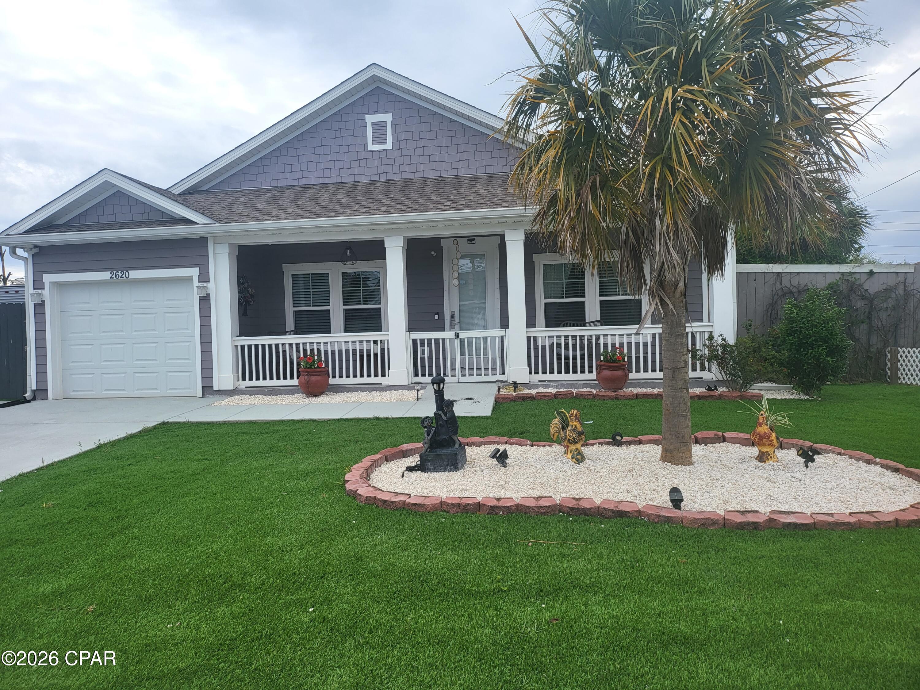 ONE-OF-A-KIND CONTEMPORARY CUSTOM-BUILT PANAMA CITY BEACH HOME! Pride of ownership is evident throughout this beautifully maintained single-story residence featuring quality craftsmanship and numerous upgrades. Highlights include durable Hardie Board siding, gated entry, irrigation system, covered front porch with tile flooring, and an attached one-car garage with epoxy floor, automatic opener, and pull-down attic storage. The open-concept floor plan offers a spacious living room, dining area, and kitchen designed for comfortable living and entertaining. The kitchen features custom cabinetry, quartz countertops, LG stainless appliances, range hood, microwave, dishwasher, breakfast bar, pantry, and premium lighting and plumbing fixtures. Tray ceilings and custom ceiling fans throughout the home add style and elegance. The primary suite features a luxurious bath with double vanity, soaking tub, separate shower, custom cabinetry, and quartz countertops. A dedicated laundry room provides additional storage and convenience. Step outside to enjoy the large covered rear patio with tile flooring and ceiling fan overlooking the privacy-fenced backyard. Additional exterior features include a storage shed and dedicated RV parking area with hookups. Approved for both short-term and long-term rentals, this property is ideal as a primary residence, vacation home, or investment opportunity. Conveniently located just minutes from shopping, restaurants, bay access, marinas, and the white sand beaches of Panama City Beach. This exceptional home truly stands apart from the rest.