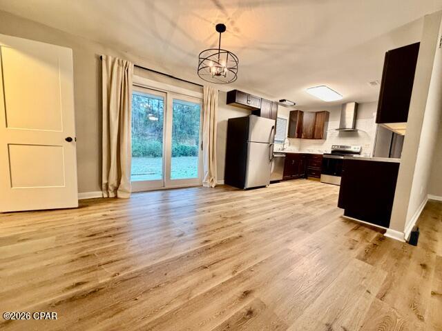 Check out this beautifully remodeled 3-bedroom,2-bathroom brick ranch in the serene town of Graceville. Just a short walk from the charming downtown area, this home is ready for you to move in and enjoy the delightful North Florida spring weather. The property spans over an acre, offering ample space for your toys, RVs, a large workshop or pole barn, or even a pool. Inside, you'll find new appliances, flooring, paint, and lighting fixtures. The spacious den is perfect for family gatherings or any fun-filled events.    For those who need a storage/sewing/or office space, there's an additional room that will work great.  This home looks brand new, and with new roof and HVAC, it's a great buy.  (All info is approximate and buyer to verify anything that is important.)