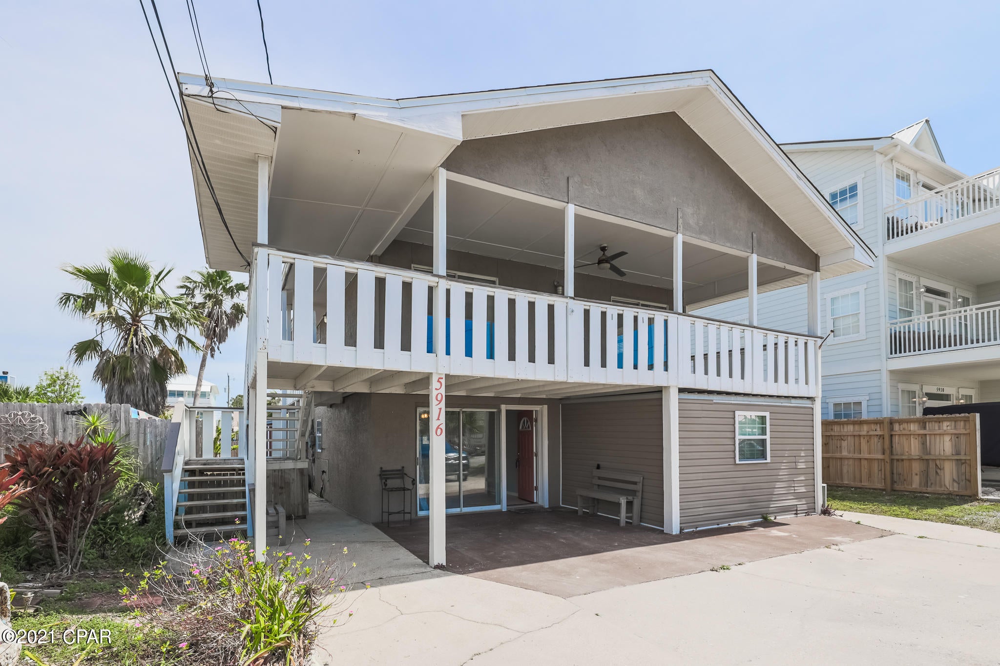 GREAT Investment property just a few blocks from the World's Most Beautiful Beaches! A little TLC and this Triplex can be turned into a Long or Short term rental. Upstairs is a 2-bed-2-bath with kitchen / living room open concept and large balcony. 2 separate units downstairs. Bottom Left is a 2-bed/1-bath and bottom right is an enclosed efficiency. Shared Laundry room is on the left side. The 2 units downstairs currently share 1 water heater and electric meter. HVAC upstairs is currently not functioning. Property is on Septic and city water. - All measurements are approximate, please verify if important.