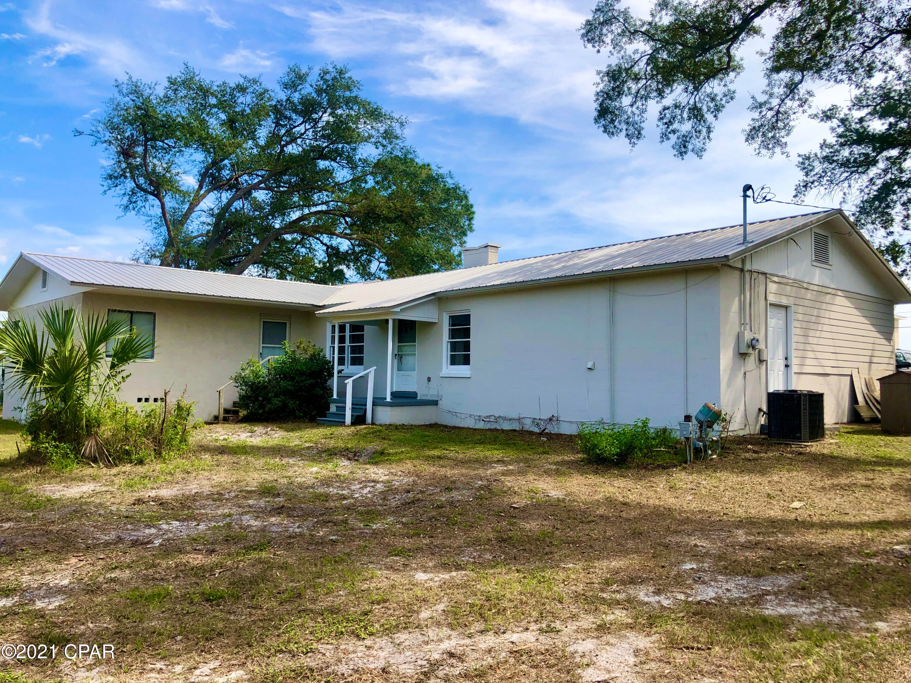CURRENTLY UNDER CONTRACT, SELLER ACCEPTING BACKUP OFFERS--Here's a 4 bedroom, 2 & 1/2 bath, with office space. Stainless Steel appliances and granite counter tops await you in the kitchen, new roof in 2019. tile and new carpet, central heat and air, separate dining rm, fireplace in great room. Centrally located on 11th Street between Lisenby and Balboa, you can be anywhere you need in just minutes.  2 blocks away from Saint Andrews bay.  Walk to the bay and sit, relax and unwind. Home comes with a 1 year warranty.