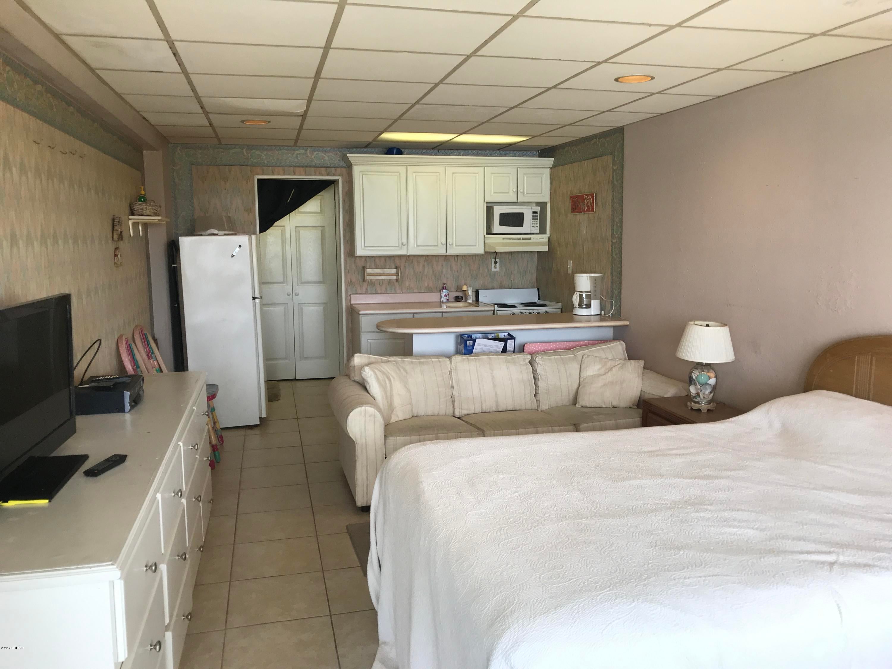 If you are looking for an investment ON THE BEACH, this is the least expensive unit for sale.  New A/C, Tile Floors, Beautiful View of Beach and Gulf. All Utilities included in HOA dues.  This unit just needs some TLC!
