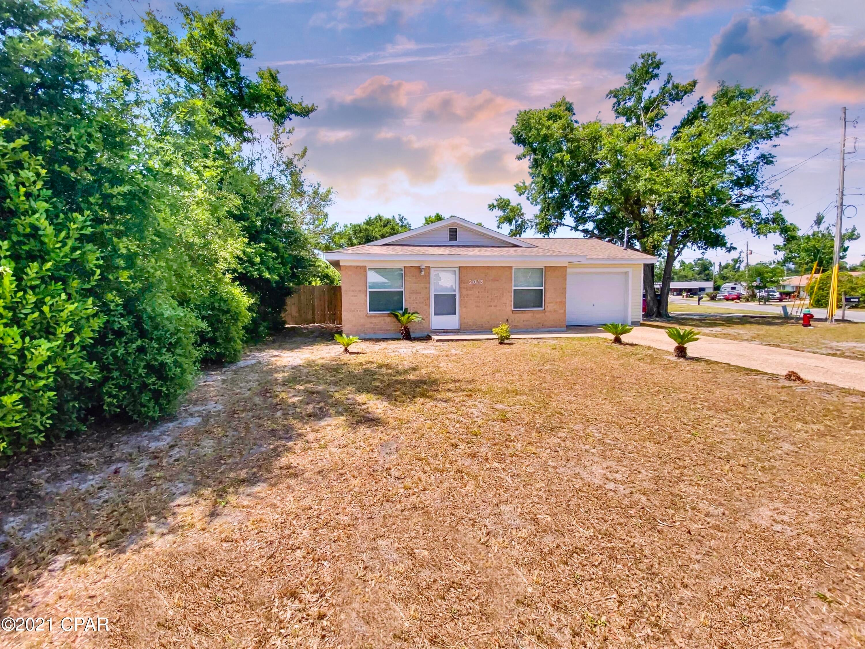 CURRENTLY UNDER CONTRACT, SELLER ACCEPTING BACKUP OFFERS' Adorable describes this well maintained brick home with one car garage.  The home features tile flooring throughout for easy maintenance.  New stainless steel appliances for the cook of the family.  The roof was reroofed in 2019 and windows were replaced in 2018 which will save on utility bills.  The yard is partially fenced.  This home would be great for a first time homebuyer or for a rental.  Close to shopping and the college. Make your appointment today! All measurements are approximate.  Please measure to verify.