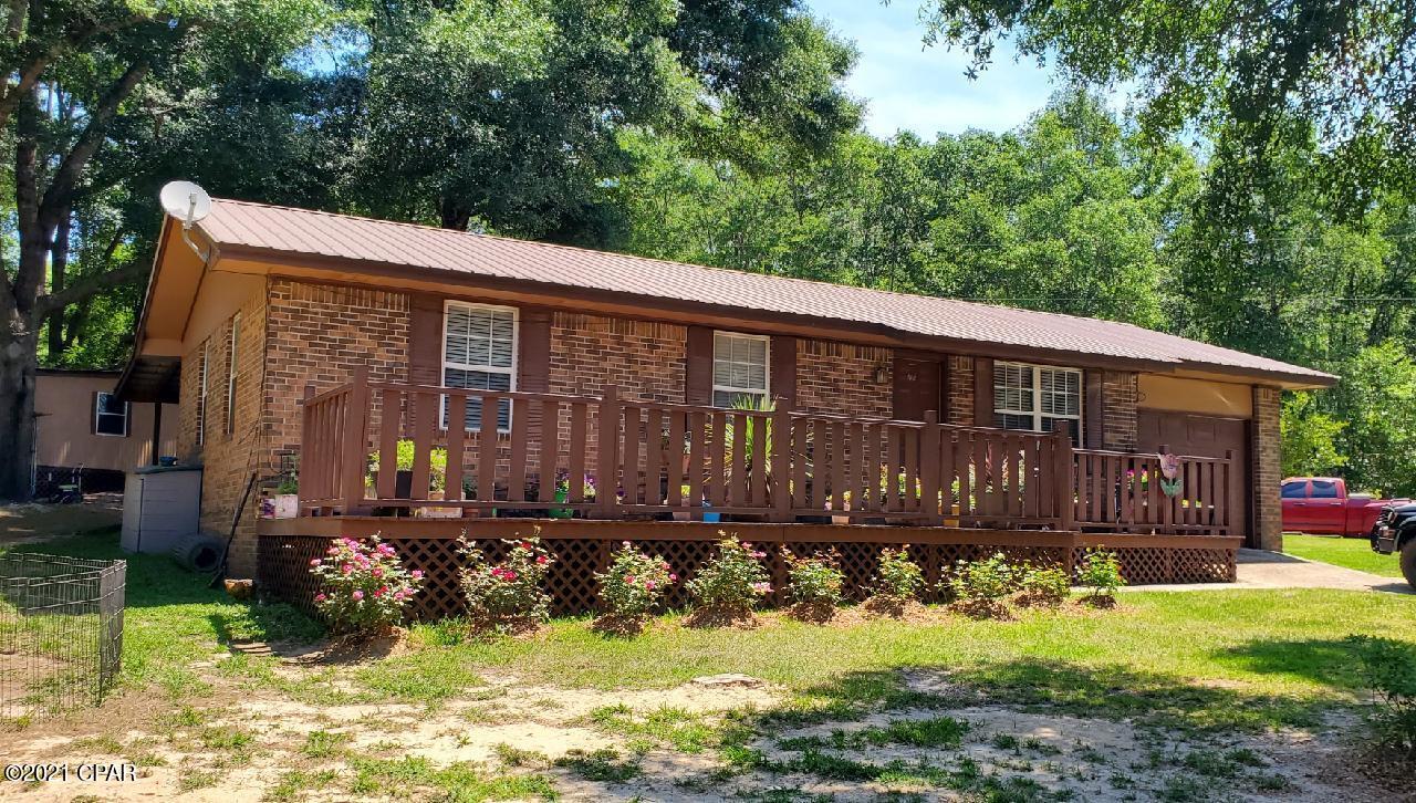 Perfect country home beautifully landscaped, serene and peaceful. You can really escape to the county here!  Home is updated with granite counter tops, stainless appliances,new ac, and new septic tank. . additionall storage buildings. Sit on your front porch and relax. Great decks to enjoy the outdoors!  Additional land available.  Home is offered on 1 acre mol. Seller has contingency that both properties sell around the same time.