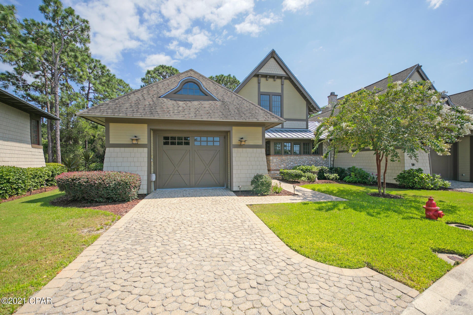 After entering the gate into Wild Heron, you realize you are in a ''Coastal Sanctuary''. Minutes from the beaches and 30A, you immediately feel at one with nature, away from the crowds. This guarded and gated community offers calm and security for both full time residents and second homeowners in this carefully planned low density development of 750 acres. This beautiful townhome offers luxury living with low maintenance. The units are handsome Coastal Craftsman designs by renowned Dungan Nequette Architects. Upon entering the home you look directly into the light filled great room with beamed ceilings, gas fireplace and a large bank of windows that showcase the conservation land behind the home. grade stainless appliances, solid hardwood cabinetry, and a wine fridge. Hardwood floors throughout, tile in all baths with Kohler Memoir faucets and fixtures, granite counters throughout, 8ft solid core doors. The Master is on the first floor with a large bathroom, dual sinks, separate tub and shower, and a generous walk in closet. Just off the living area is a powder bath. A lovely porch is off the living area which overlooks the nature preserve on this end unit. Also on the first floor is a laundry room with a sink and cabinets. The light filled staircase takes you to the second floor with two guest rooms, each with ensuite baths, as well as a sitting room/office. Wild Heron has a lakeside community pool, fitness center, boathouse for kayaks and paddle boards, community dock, fire pit, and miles of walking paths through the community. Golf and tennis are available with memberships through Clubs of St. Joe.