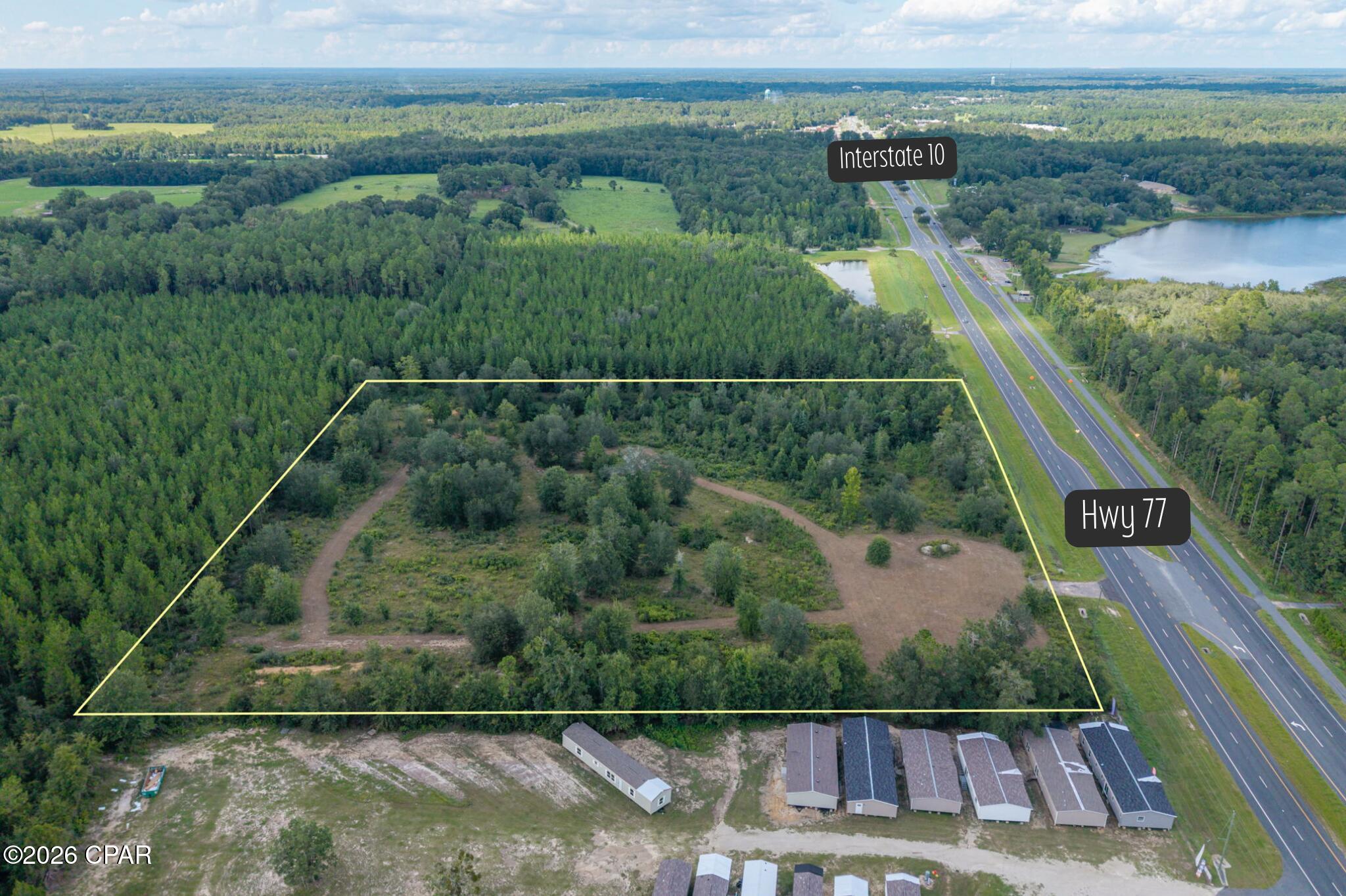 Over 10 acres of commercial property on Highway 77 with excellent visibility and convenient access to I-10--this is an opportunity worth a closer look! This 10.23-acre parcel offers the space, location, and flexibility to accommodate a wide range of commercial uses and future development plans. Situated along one of the area's well-traveled corridors, the property provides over 10 acres to work with, giving you room to create a development that fits your vision. Whether you're looking for a location for a new business, additional space for an expanding operation, or a commercial investment, the size and accessibility of this property provide plenty of options. Location is a major advantage, with I-10 just minutes away and the property conveniently located outside the city of Chipley. Restaurants, shopping, Walmart, and other everyday conveniences are nearby, while Falling Waters State Park is approximately 2.2 miles away and Panama City Beaches are approximately 49 miles away. With an average daily traffic count of approximately 8,900 vehicles according to 2025 DOT data, Highway 77 provides valuable exposure for businesses that benefit from visibility and easy access. Acreage, highway frontage, visibility, and proximity to I-10 all come together to make this property a standout commercial opportunity in the Chipley area.