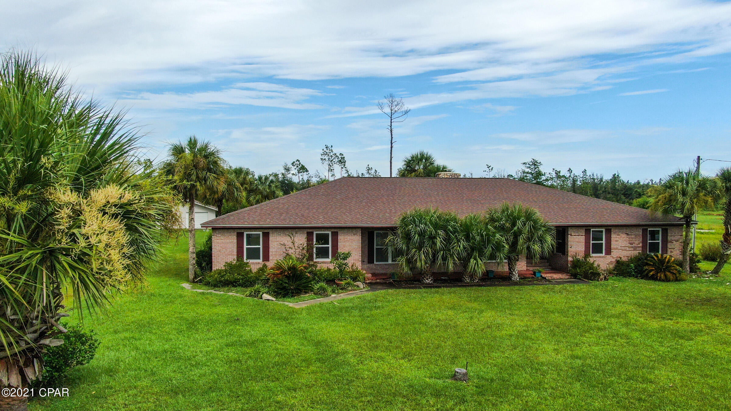 CURRENTLY UNDER CONTRACT, SELLER ACCEPTING BACKUP OFFERS With only a 10 minute drive to town you can own a ranch style house that sits on 1 acre with detached garage and storage house. Plenty of space inside the house as well with  ample bedrooms sizes, large living room, dining room and bonus room. Need a separate space with a kitchen, look no further as on the north side of the house has a bonus room with large windows and a studio style kitchen including a separate entrance.  The bedroom on north side has handicap accessible bathroom. Down the hall is the laundry room that leads to the enclosed patio, perfect for your morning cup of joe.  Along the kitchen hallway is a 16 foot glass built in storage.  Kitchen has a beautiful bay window overlooking the backyard.  The main bedroom has a s The main bathroom has lots of natural light from the sky light. Right outside the bedrooms is a safe room. The guest bathrooms also has a sky light and a fully tiled shower.  Call your favorite realtor today for showing.
