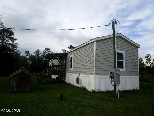 GREAT OPPORTUNITY to own your own home in a quiet rural setting, yet it is just a short drive to the City!  This home with its split-floor plan has had many updates within the last few years that include vinyl plank flooring, stove, dishwasher and a/c unit.  The home features a large wall of bookcases that separates the kitchen and living room.  A new well and septicsystem was installed in 2024, and there is an outside shed for additional storage.  Take a look and see all that it has to offer!