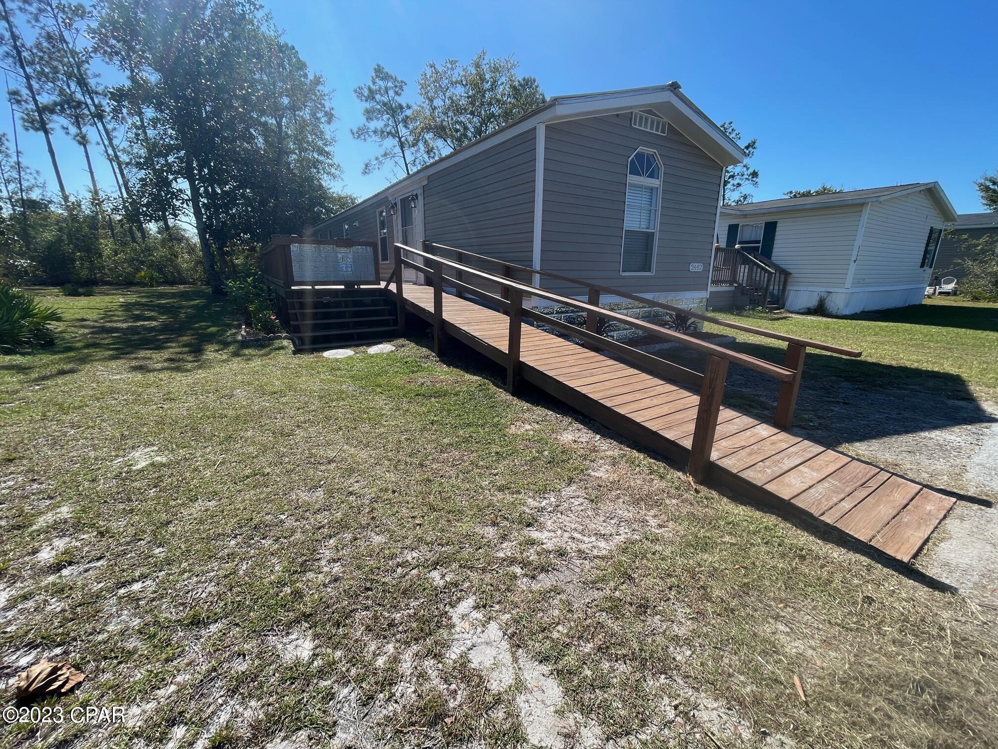 Close to Tyndall AFB and Panama City Mall; short drive to Panama City Beach, FSU and GCSC. Home completely renovated with metal roofing,
kitchen and bath upgrades, nautical textured walls, LVP flooring, recessed LED lighting, ceiling fans, cordless blinds and carpeted bedrooms. Huge patio deck
overlooking tropical woods with a very private feel. Large kitchen area open to living room with plenty of cabinets, breakfast bar, with stainless-steel appliances included. Master bedroom is spacious with a full-length closet with private master bath that offers his and hers sinks, vanity station with additional shelfing throughout. Laundry room has matching Whirlpool washer and dryer with plenty of shelving. Large 8x10-ft shed with worktable in backyard!  Pet friendly -- must get approval​​‌​​​​‌​‌​​​​‌​​‌​​​​‌‌ first.