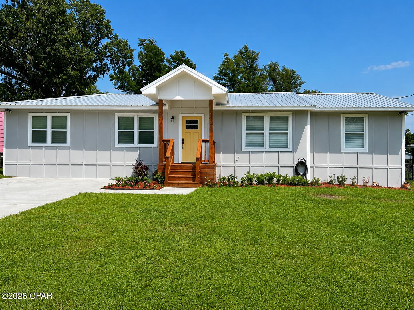 Beautifully remodeled home in Panama City's highly sought-after Cove neighborhood! From the moment you enter, you will appreciate the spacious open floor plan, vaulted ceiling, recessed lighting, and luxury vinyl plank flooring throughout.
The modern kitchen is designed for everyday living and entertaining, featuring an impressive 9-foot island, pantry, refrigerator with water and ice dispenser, and a self-cleaning glass-top range that even has a bread-proofing feature. The island has a hidden power bank.  Both bathrooms feature double vanities and attractive tilework. The hallway bath has a tub/shower and the master ensuite has a tiled stand up shower.
The owner has added a large back deck, creating a wonderful space for morning coffee, evening relaxation, and entertaining. A backyard shed provides additional storage, and the home also features a concrete driveway.  The backyard is now completely privacy fenced with a double gate to allow alley access.

Located just half a block from Sudduth Park, residents can easily enjoy the baseball diamond and playground. Cherry Street Elementary is within walking distance, and downtown Panama City is accessible by bicycle or golf cart for the Saturday farmers market, festivals, shops, live music, dining, and community events. Along the way, enjoy the scenic Beach Drive area, where the Cove Events Committee hosts its Fourth of July celebration. The neighborhood also embraces its golf-cart lifestyle with festive parades for Christmas, Halloween, and the Fourth of July. This updated Cove home offers a wonderful combination of modern comfort, outdoor living, and a convenient neighborhood location! 
Information is deemed reliable but not guaranteed. All measurements and property details are approximate and should be verified by buyer.