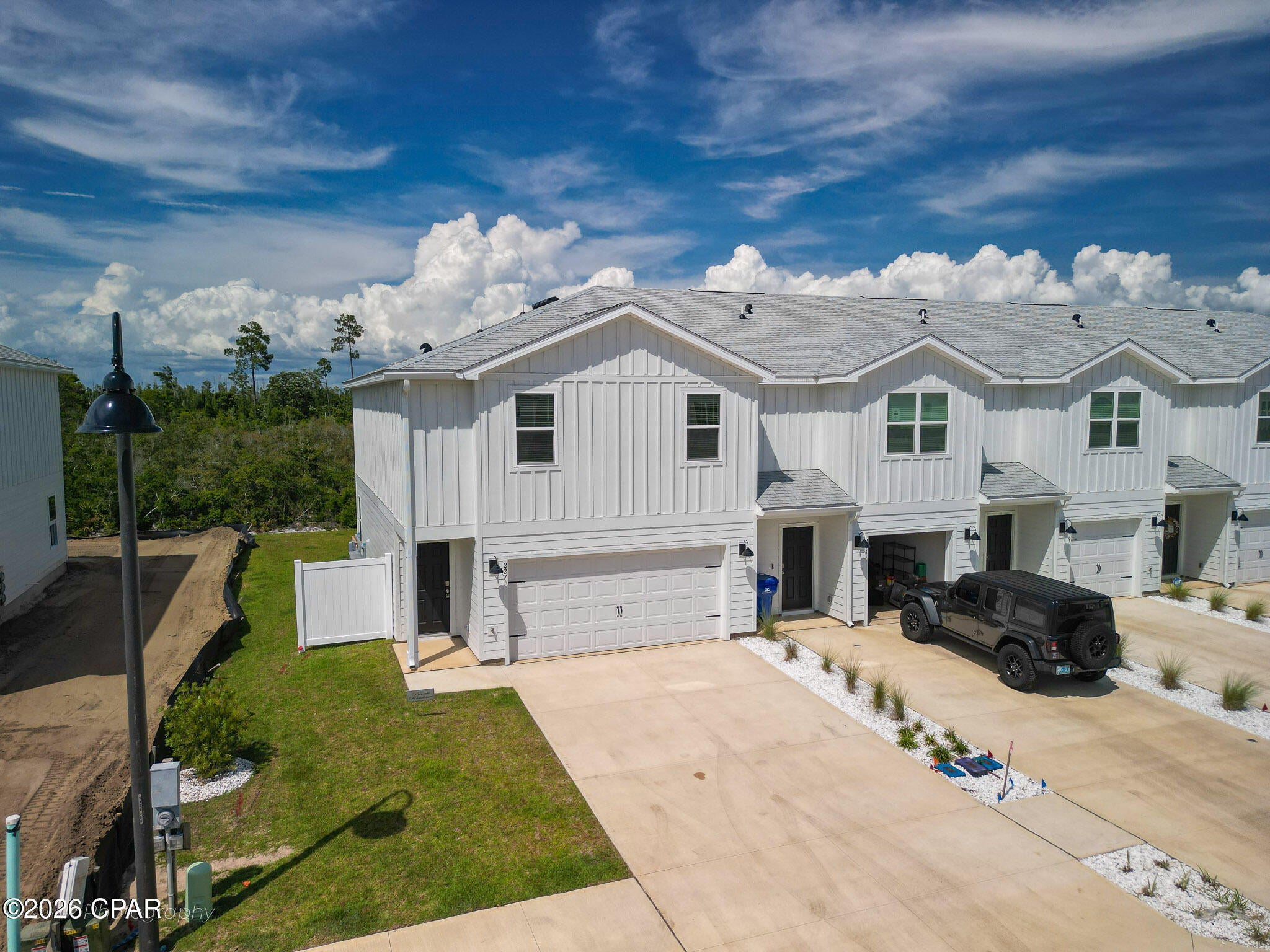 Calling all military families and Gulf Coast dreamers: OWNER FINANCING AVAILABLE! No Flood Insurance Needed! This beautifully designed 4-bedroom, 3.5-bath townhome sits just 13 miles from Tyndall Air Force Base, offering an easy commute and a coastal lifestyle that feels like a permanent vacation. With VA-loan-friendly appeal and low-maintenance living, 227 Salt Creek Lane is the perfect fit for service members PCSing to the area, full-time residents, or anyone seeking a relaxed second-home getaway on Florida's Forgotten Coast. Wake up to salty breezes and end your days beneath wide-open Gulf skies in this 1,726 sf home in Salt Creek at Mexico Beach. Tucked along the peaceful west end of town, it offers a two-car garage and easy access to five miles of sugar-white sand, emerald water, and the nearby boat launch--so every weekend feels like a getaway. Inside, a thoughtfully planned floorplan is built for the way coastal life is really lived: room to host family and friends, space for guests or a home office, and finishes that reflect the relaxed, sunlit character of the Gulf Coast. Four bedrooms and three and a half baths give you the flexibility to settle in, host visitors, or stretch out. Step onto your private porch--the perfect spot for morning coffee or unwinding after a day on the water. Beyond your door, Salt Creek is a connected, friendly community built around the simple pleasures of shoreline living--sunrise walks, paddleboarding, fishing, and evenings spent watching the sun melt into the Gulf. HOA even handles to landscaping! Convenient to Port St. Joe and Panama City for dining, shopping, healthcare, and schools, this is a location that works as hard as it relaxes. This is more than a townhome--it's an invitation to belong to one of Florida's most beloved stretches of coast. Whether you're stationed nearby, settling down, or searching for your coastal escape, 227 Salt Creek Lane is ready to welcome you home. Your place on the Forgotten Coast is waiting.