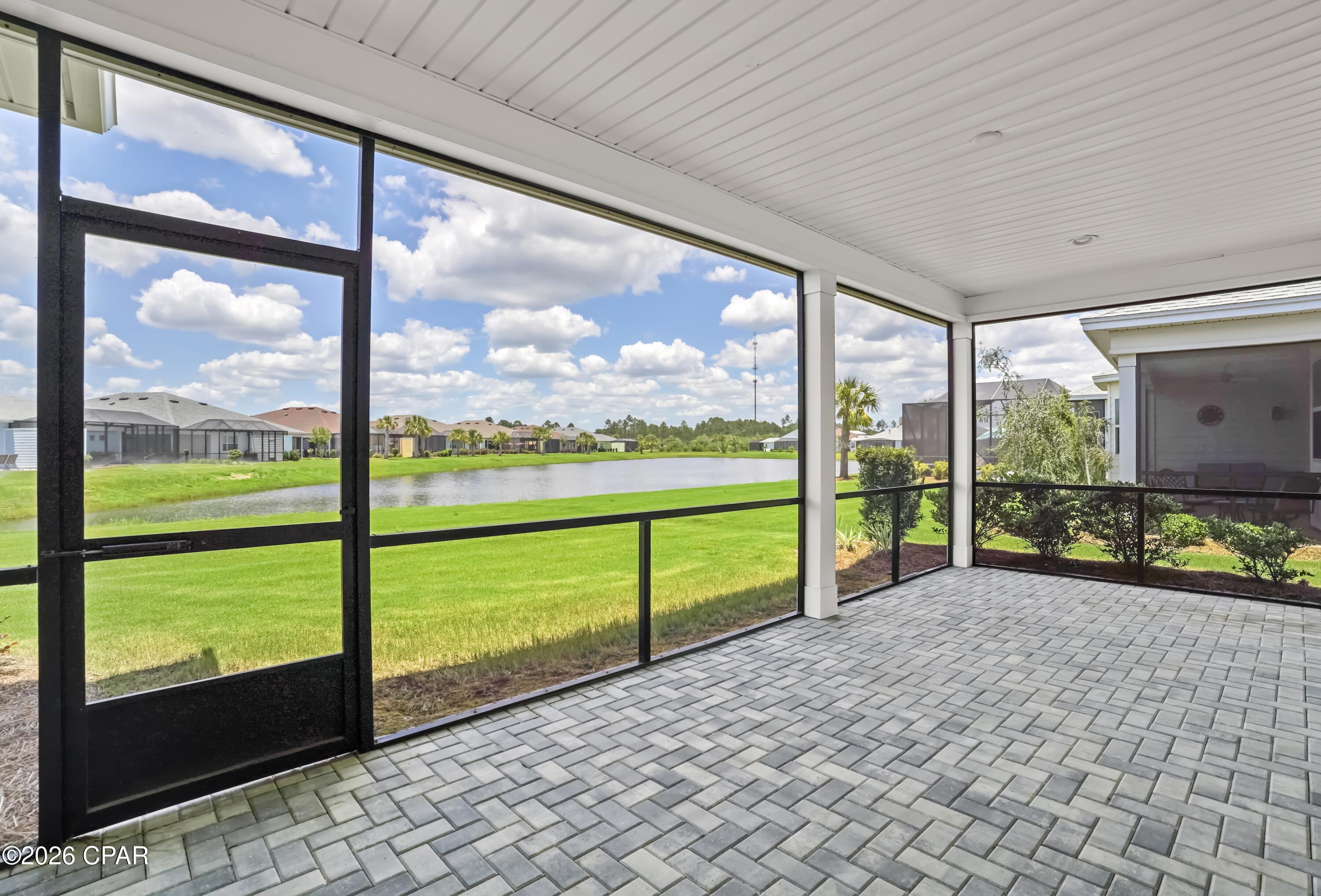 Welcome a beautiful Breeze floor plan in Latitude Margaritaville Watersound, perfectly positioned on the pond with peaceful water views. Located in highly desirable Phase 2, one of the closest phases to the amazing Town Square, this 2-bedroom, 2.5-bath home offers a bright, easy-living layout with the ideal blend of fresh updates to make it your own.

Recently refreshed with interior paint, new tile, updated lighting, disposal in 2026. The living room is accented with a beam, this home already has a clean, stylish foundation ready for your personal design style. The open-concept living and dining spaces flow beautifully, creating a comfortable setting for everyday living, entertaining, and relaxing after a day enjoying the resort-style amenities.
Step outside and enjoy the calm pond view, where mornings feel peaceful and evenings invite you to unwind. 

Enjoy the signature lifestyle just moments from Town Square with golf cart rides, friendly neighbors, live music, fitness, pickleball, pools, dining, social clubs, and the laid-back energy that makes every day feel like a vacation. Fresh, inviting, and full of potential, this home is ready for you to bring your vision and start living your best beach life whether you are dreaming of a full-time coastal lifestyle, a low-maintenance second home, or your next chapter in one of the area's most loved 55+ communities, this Breeze offers a wonderful opportunity inside Latitude Margaritaville Watersound