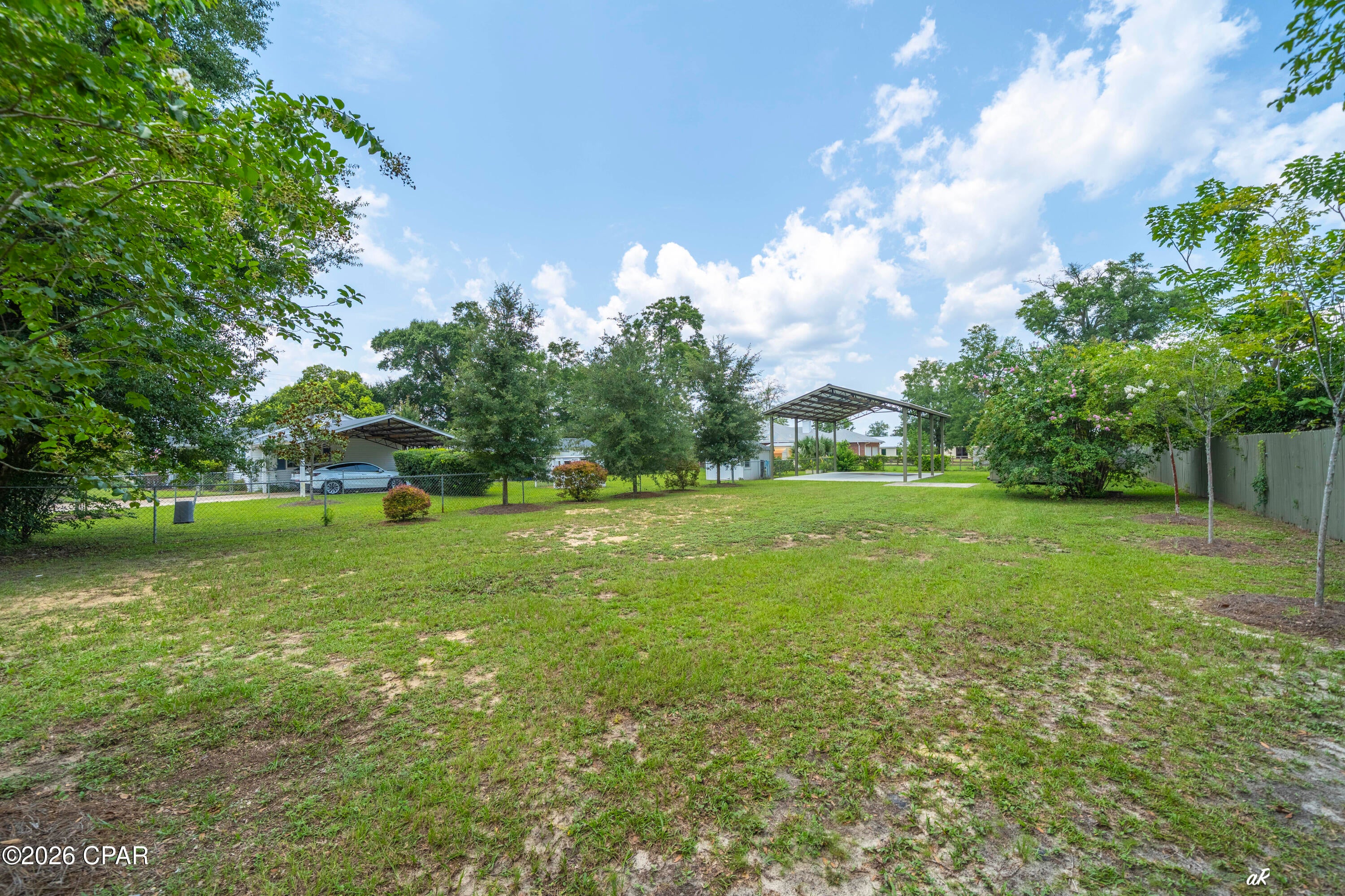Need storage for your toys close to town? Secure lot for your Motor Home, Boat, Camper, Trailers. Huge Pole Barn with Concrete Pad. Fenced and Landscaped. Drive by and take a look.