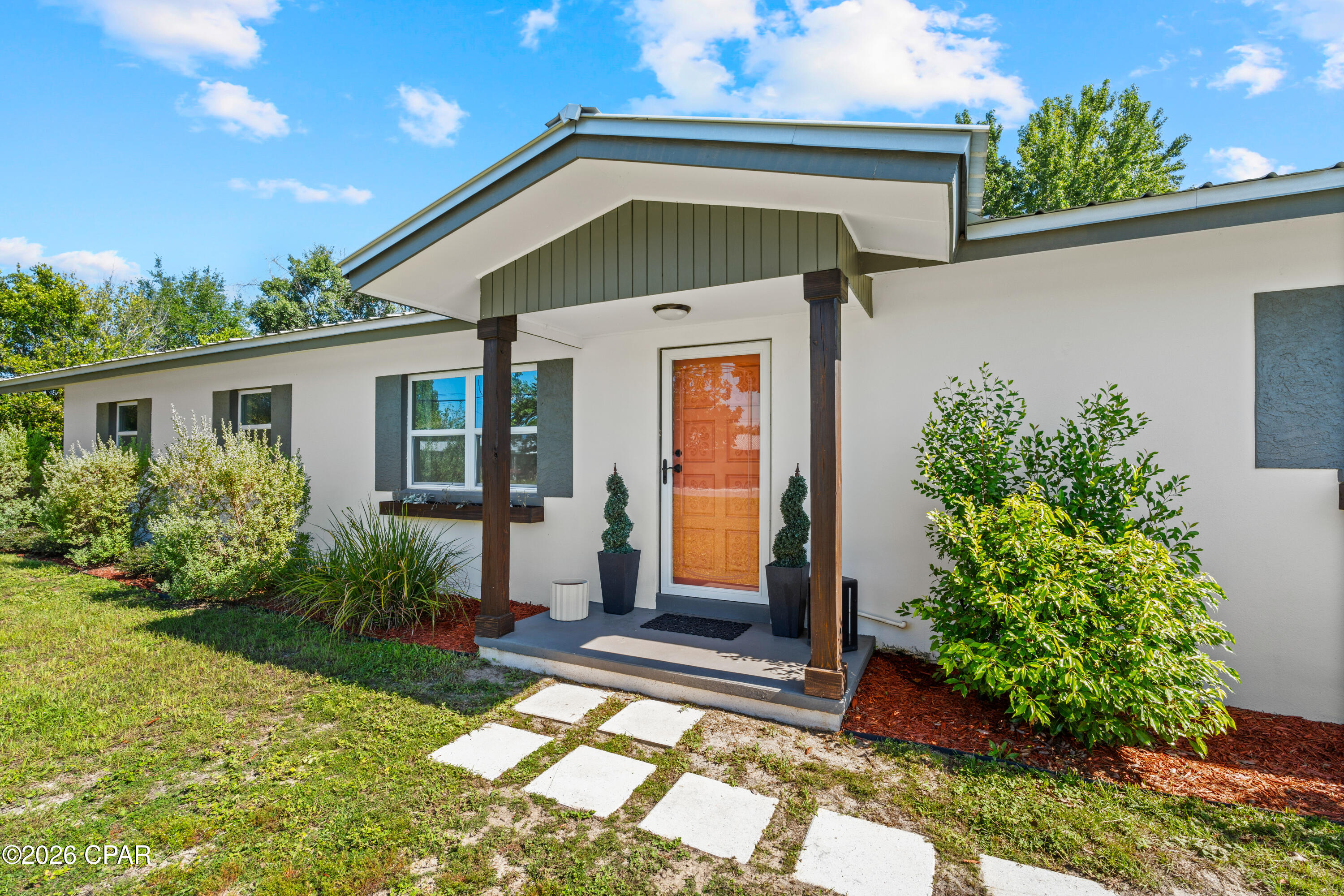 *Available July 29th* Welcome to this beautifully remodeled 4-bedroom, 2-bath home with a single-car garage, where modern design meets everyday comfort. 

The showpiece kitchen is designed for both entertaining and daily living, featuring a stunning 8' x 4' center island, custom cabinetry, granite countertops, stainless steel appliances, and abundant space. New luxury vinyl plank flooring flows throughout the home, creating a seamless, contemporary look.

The spacious primary suite offers a private retreat with a generous walk-in closet and a beautifully renovated bathroom featuring a custom tile walk-in shower. The secondary bathroom has also been completely updated with modern cabinetry and finishes.

Situated on a ½-acre lot, the property provides plenty of space for outdoor living, recreation, or additional parking. The home is serviced by a private well and septic system and includes a water softener.

Conveniently located in the heart of Panama City, you'll enjoy quick access to schools, shopping, restaurants, medical facilities, and everyday conveniences. This move-in-ready home offers the perfect combination of modern updates, generous space, and a prime central location. Schedule your private showing today!