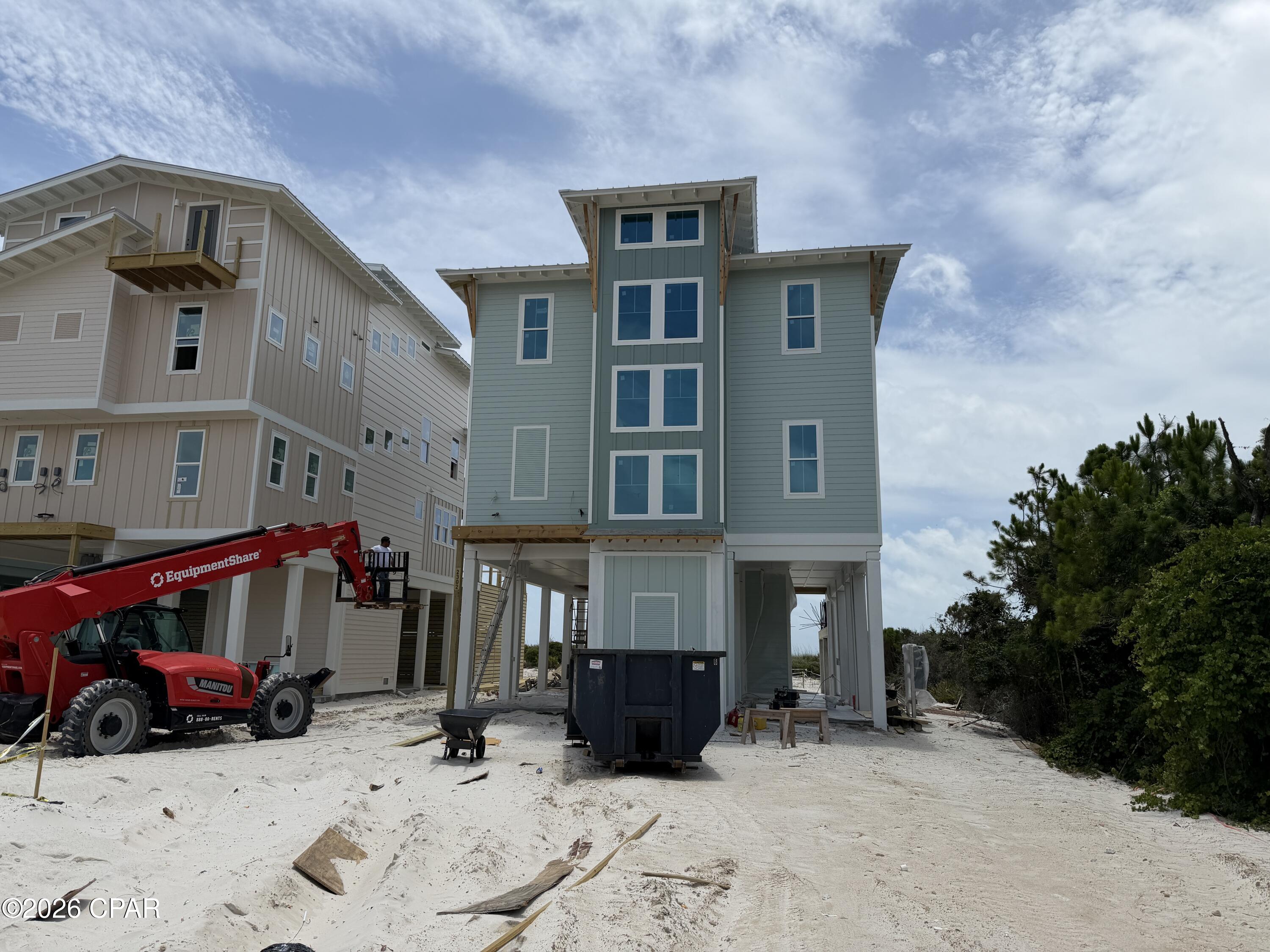 ISLAND LUXURY AWAITS! Experience the best of St. George Island from this stunning Gulf-front brand new construction home located in the exclusive Heron's Crossing enclave. Perfectly positioned to capture breathtaking Gulf views, coastal breezes & unforgettable sunsets, this beautifully designed 5-bedroom, 5.5- bath home offers the ideal blend of luxury, comfort & island living. The open-concept floor plan is filled with natural light & showcases high-end finishes throughout, including designer cabinetry, premium countertops, wide-plank flooring, elevator & elevated trim details. At the heart of the home, the chef-inspired kitchen features a professional-grade range, custom vent hood, stainless steel appliances & generous space for gathering with family & friends. Spacious living & dining areas flow seamlessly together, creating an inviting atmosphere for entertaining or relaxing after a day on the beach. Each bedroom offers privacy & comfort, making this home ideal for large families, vacation guests or a high-performing rental investment. Walls of windows frame spectacular Gulf views while the coastal-inspired design creates a warm, sophisticated feel throughout. Step outside to your private beachfront oasis featuring an inground pool, expansive outdoor living areas & direct access to the sugar-white sands of St. George Island. Enjoy morning coffee overlooking the water, afternoons spent poolside & evenings watching the sun disappear into the Gulf. Enjoy the peaceful coastal setting with direct access to pristine dog friendly beaches along with local nature trails, world-class fishing, boating, kayaking & endless opportunities for outdoor recreation. Whether you're searching for a primary residence, second home or investment property, this exceptional Gulf-front retreat delivers the ultimate island lifestyle. Call for your private tour & LIVE THE BEACH LIFE!