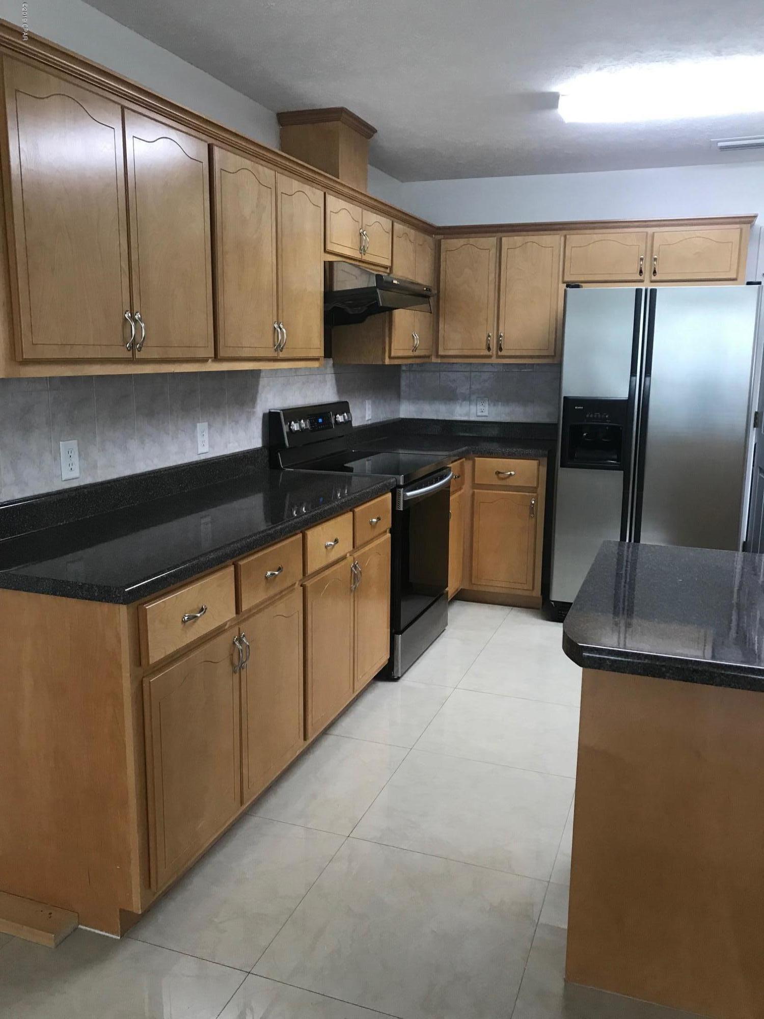 This home is in immaculate condition, new marble tile floors, kitchen, dining, living and office. Wood laminate in all bedrooms. All new appliances. Great screened porch , large laundry room.$2000 monthly rent, will mow the lawn $1800 if tenant mows the lawn