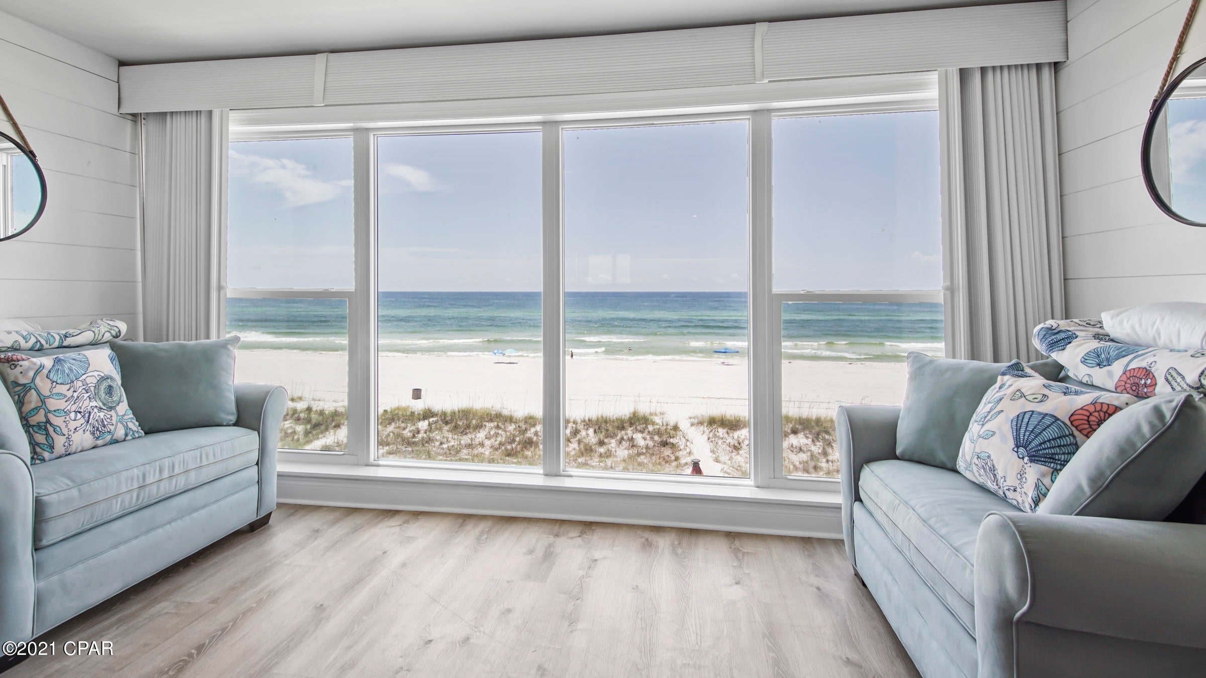 INVESTORS PARADISE!! Beautiful indoor & outdoor living. This amazing Town Home is in a prime location! On the beach 2min drive to Pier Park. The owner gutted the whole inside top to bottom in 2017. Every window has been replaced with Hurricane windows, beautiful brand new white cabinets, w/nickel plated hardware, all new LG appliances, stove, refrigerator, dishwasher, microwave, stackable washer & dryer, tiled showers in both bathrooms upstairs with glass doors. All the flooring on both floors has been replaced.Beautiful brand-new white shiplap on the walls and ceiling downstairs and accent walls upstairs. All New BLINDS threw out this beach home. NEW PAINT through out, existing stucco removed and replaced with Lap Siding and painted. THIS HOME IS A CURRENTLY WORKING AND ALWAYS BOOKED VRBO