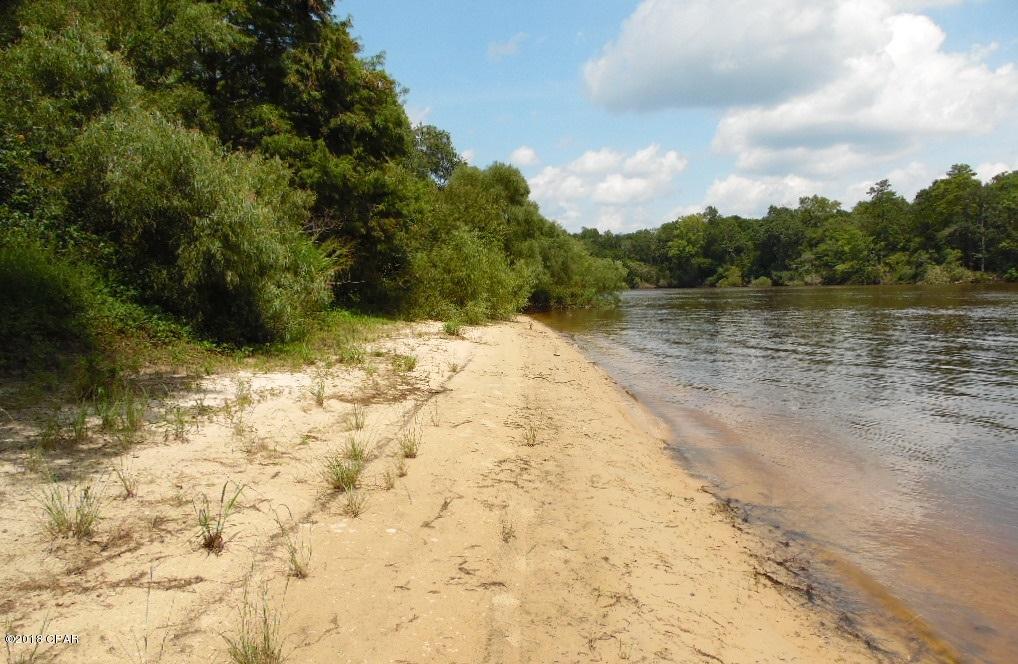 *Choctawhatchee River Waterfront Oasis** Lots 29 and 30 with approximate 185 feet of sandy river beach are being sold together. There is already electric hookup at the property and a dock. Perfect for a getaway or hunting camp site. Most of the land on the other side of the river front is water management area and would be a sportsman's paradise. Make your showing appointment today.