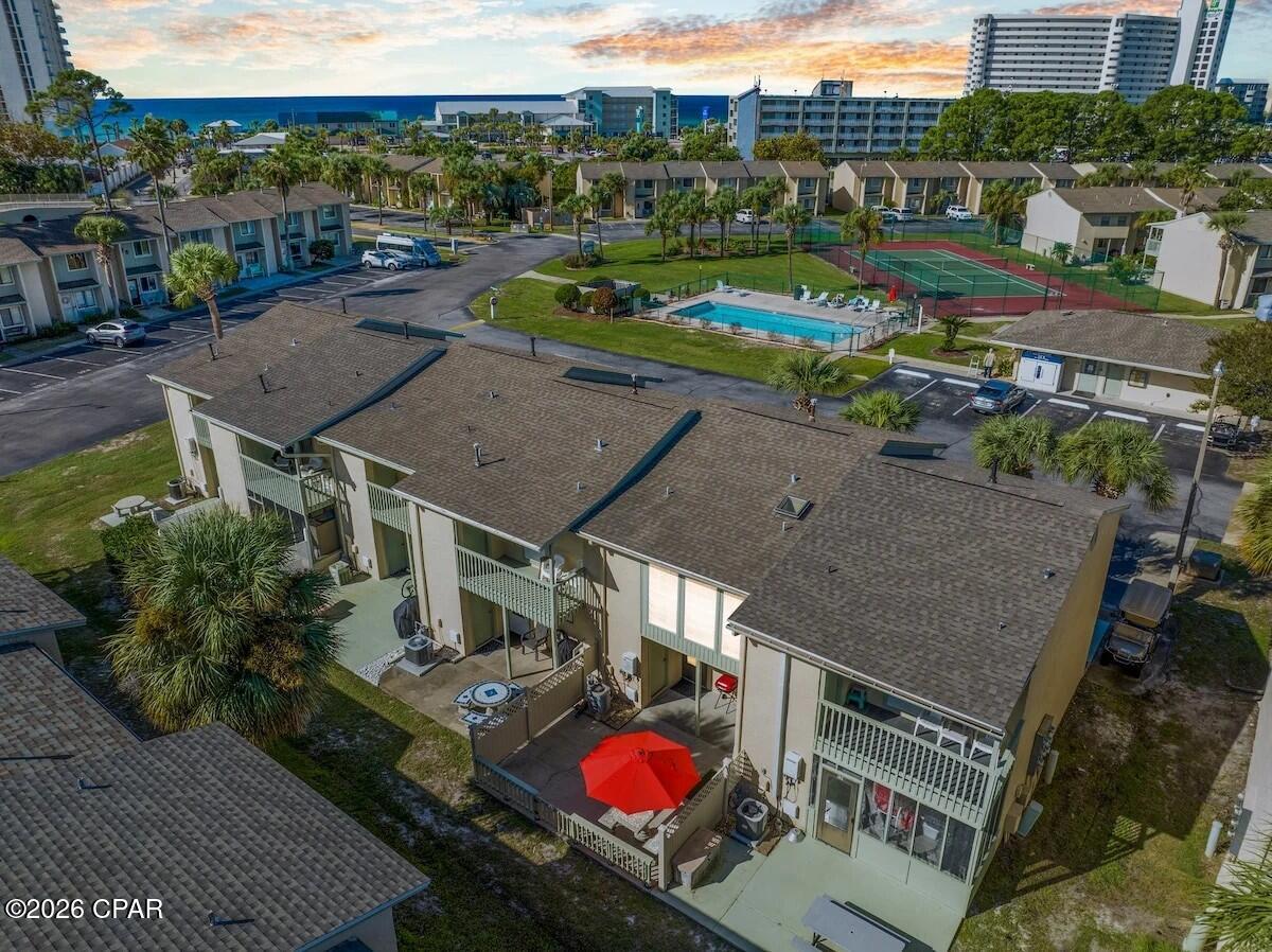 You will not find a cleaner and more well-maintained unit in Gulf Highlands Beach Resort. This townhouse makes for a great short term rental property in Panama City Beach, Florida. Located right in front of the pool, exercise room and the tennis court, walking distance to the dedicated access on Front Beach Road, making easy access to the beach and the Clubhouse. The kitchen has been renovated and has a beautiful island in the center. Upstairs the porch has been enclosed and there's an additional full bathroom. The back patio is fenced in, with a great space for gatherings. The Berber carpet downstairs and upstairs is in pristine condition so please take your shoes off when visiting. Low HOA fees, Long and Short-Term Rentals allowed. Gulf Highlands Beach Resort is a gated community with 11 swimming pools (5 heated), 4 tennis courts, a 2-acre putt-putt golf course, shuffleboard courts and Clubhouse with a pool on the beach. All measurements are deemed correct, buyers should verify if they are important.