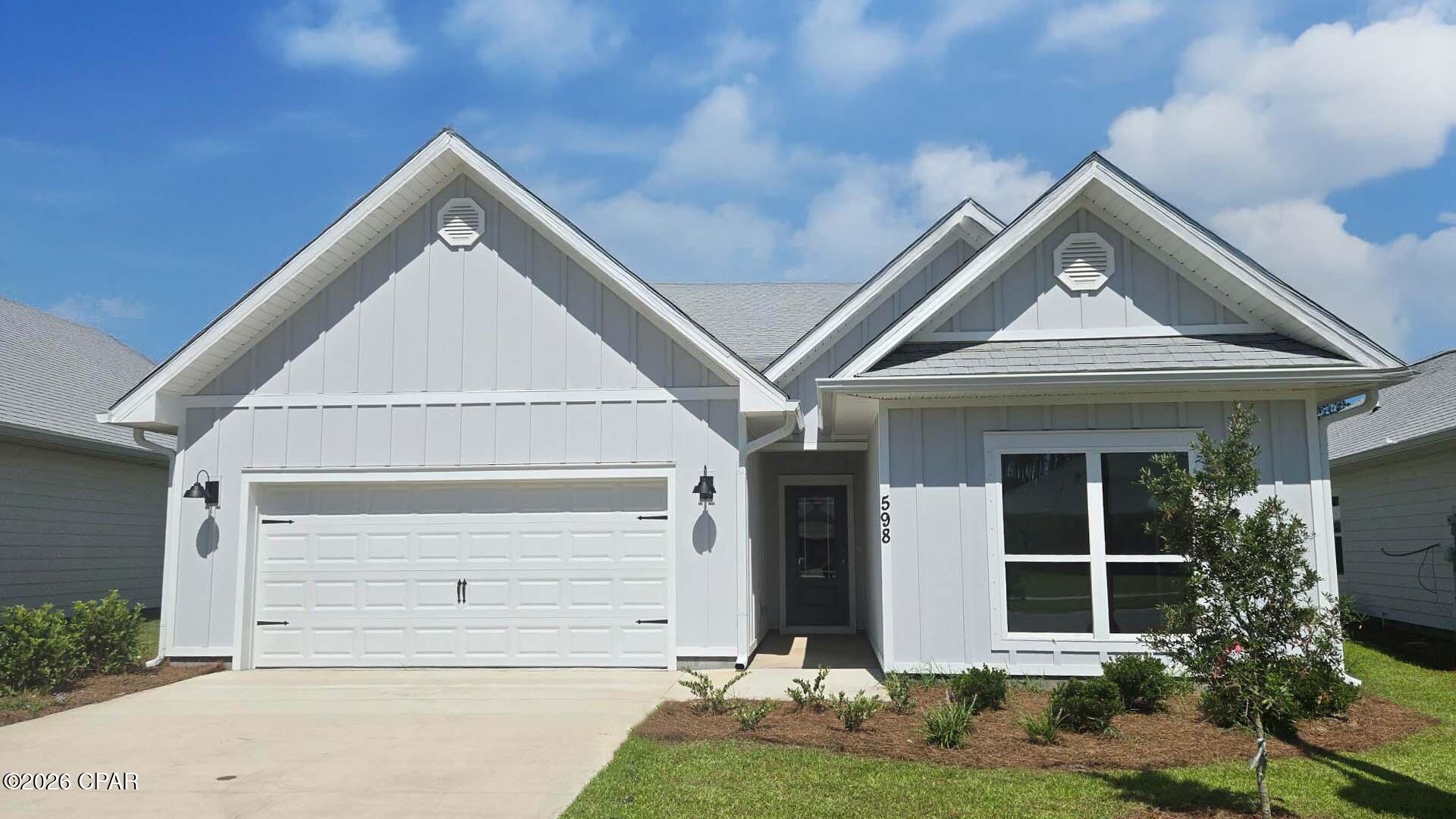 Welcome to 598 Hancock Way, a new move in ready home at Bayside at Ward Creek in Panama City Beach, Florida. This home features the Kennedy floor plan with a grand living space and modern interior features. It is thoughtfully designed layout of five bedrooms, three bathrooms, and a spacious two car garage. 

  
Off the entry hall are two guest bedrooms which share a full bathroom. At the heart of the home, you will find a grand open concept living area, brightly lit by the many windows and glass back door. The large kitchen island sits overlooking the living area and dining for easy entertaining. Modern features dress the kitchen including quartz countertops, soft-close Shaker-style cabinetry, stainless-steel appliances, and a large corner pantry. 

  
Tucked into the back of the home is a secluded hallway which holds the primary suite and adjacent laundry room. The en suite bathroom features a large soaking tub, separate standing shower, an oversized double vanity with ample storage, and a walk-in closet with ventilated shelving. Heading back into the living room and around the corner past the dining room, you will the hallway leading to two additional guest bedrooms which share the third full bathroom.