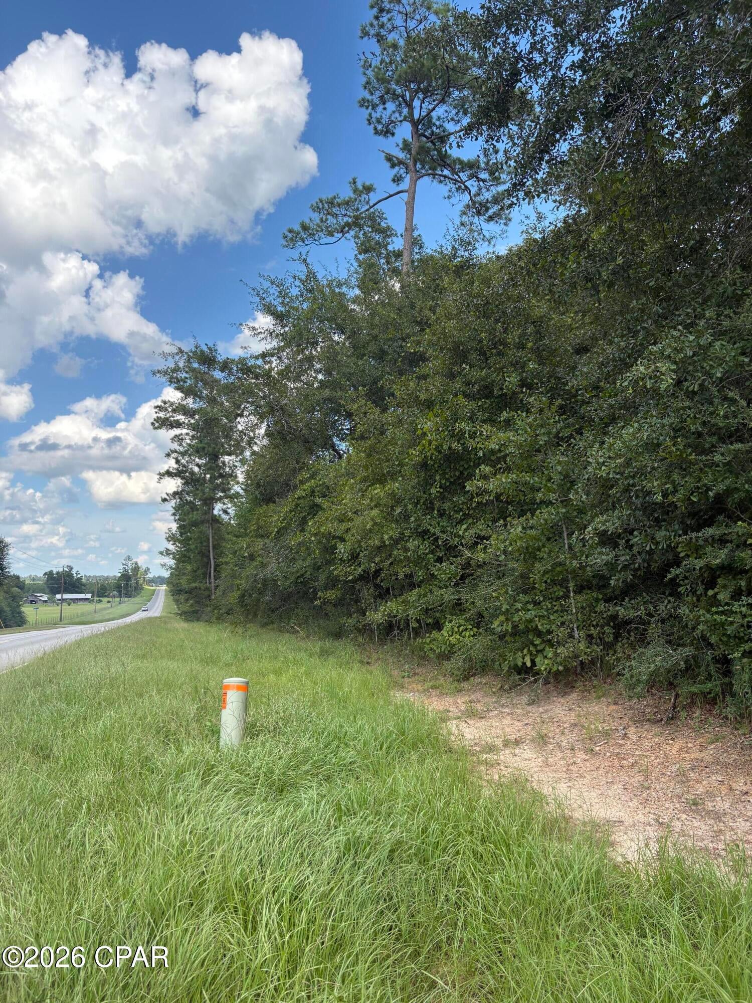 Beautiful wooded 1.18-acre MOL parcel, to be surveyed from the parent parcel, conveniently located between Marianna and Hwy 231. Enjoy over 500 feet of paved road frontage on Kynesville Rd. This property offers an ideal location for building your new home or placing a new mobile home. Conveniently located approximately 14 minutes from Jackson Hospital, Chipola College, shopping, and dining in Marianna. Hwy 231 provides easy access north to Interstate 10 and south to Panama City and the beaches. Outdoor enthusiasts will appreciate the nearby freshwater fishing opportunities, including the Chipola River and Compass Lake. The property is not located in a flood zone and is naturally wooded, allowing you to select which trees you want to keep while creating your ideal homesite. Come take a look and envision the possibilities!
