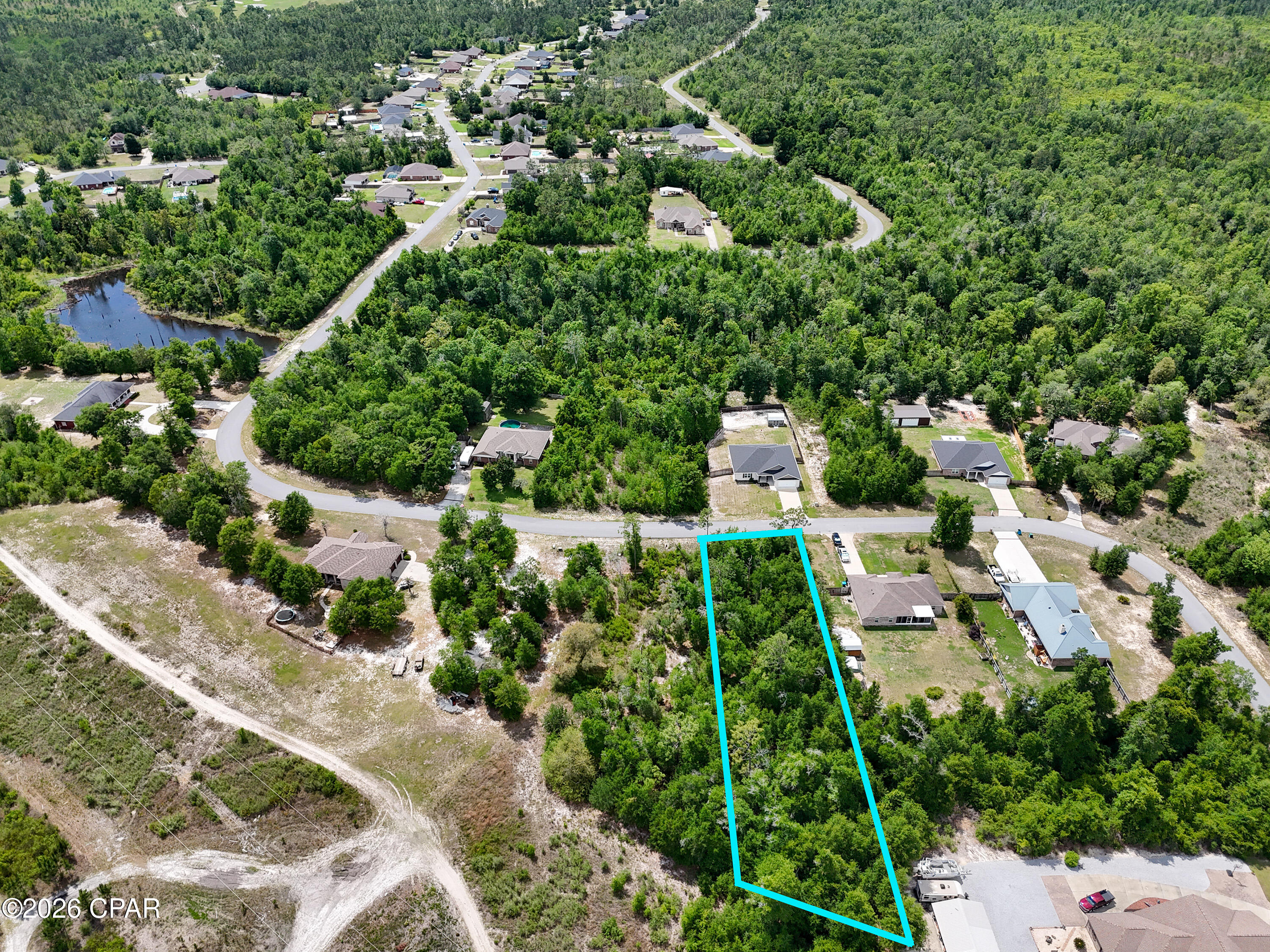 Build your dream home in the desirable Cedar Creek Chase community. This approximately 0.80-acre wooded lot offers privacy, natural surroundings, and a quiet residential setting just minutes from Lynn Haven and Panama City.

Located among established custom homes, the property features paved road access, underground utilities, and plenty of space for a custom home, pool, workshop, or outdoor living area. Enjoy the peaceful feel of a larger homesite community while still being close to schools, shopping, dining, and everyday conveniences.

Property Highlights:
• Approx. 0.80-acre wooded residential lot
• Located in established Cedar Creek Chase
• Paved road frontage with underground utilities available
• Quiet setting with spacious surrounding homesites
• Convenient to Lynn Haven, Panama City, schools, shopping, and dining
• No HOA

Rare opportunity to own a spacious homesite in one of the area's most desirable residential communities. Buyer to verify all measurements and information if important.
